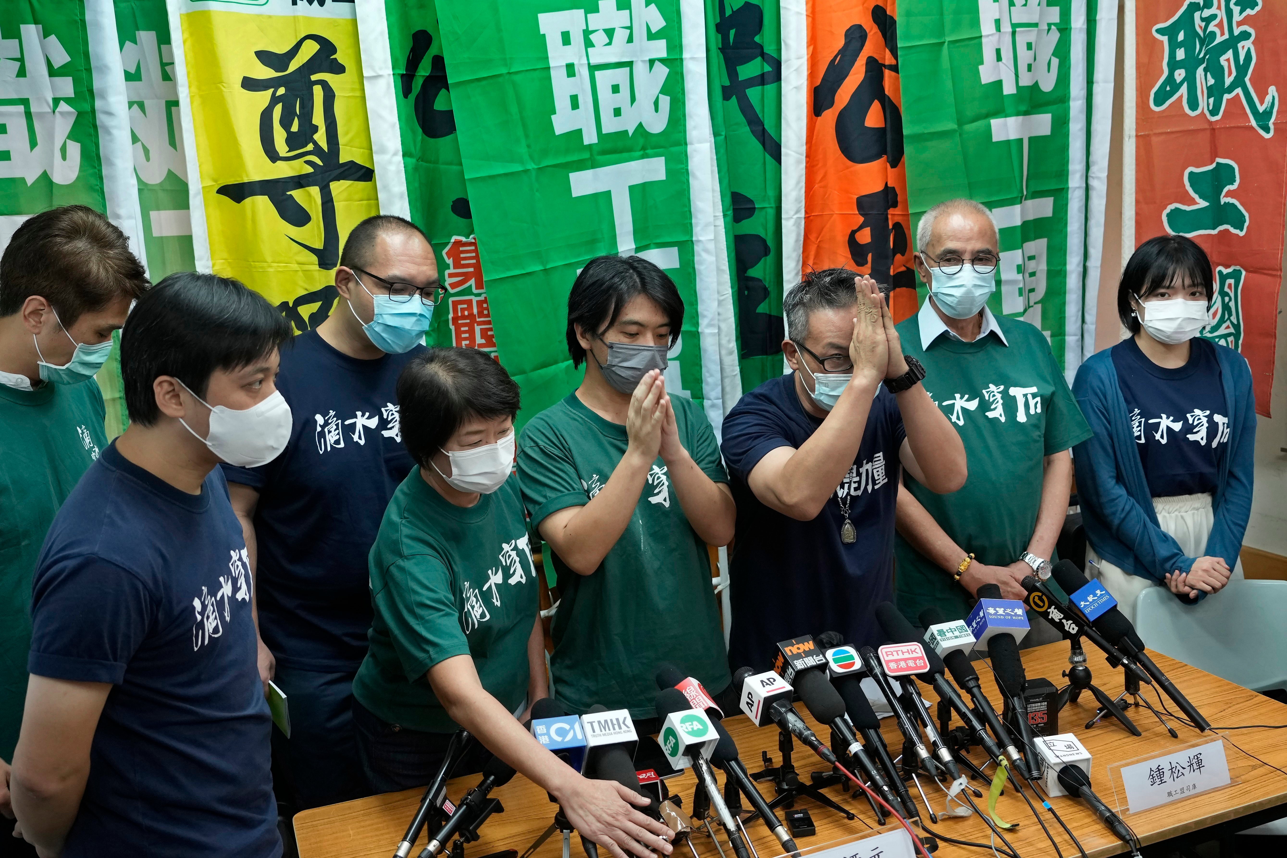 File: Vice chairman of Hong Kong Confederation of Trade Unions, Leo Tang Kin-wah, fourth from right, attends a news conference in Hong Kong on 19 September 2021