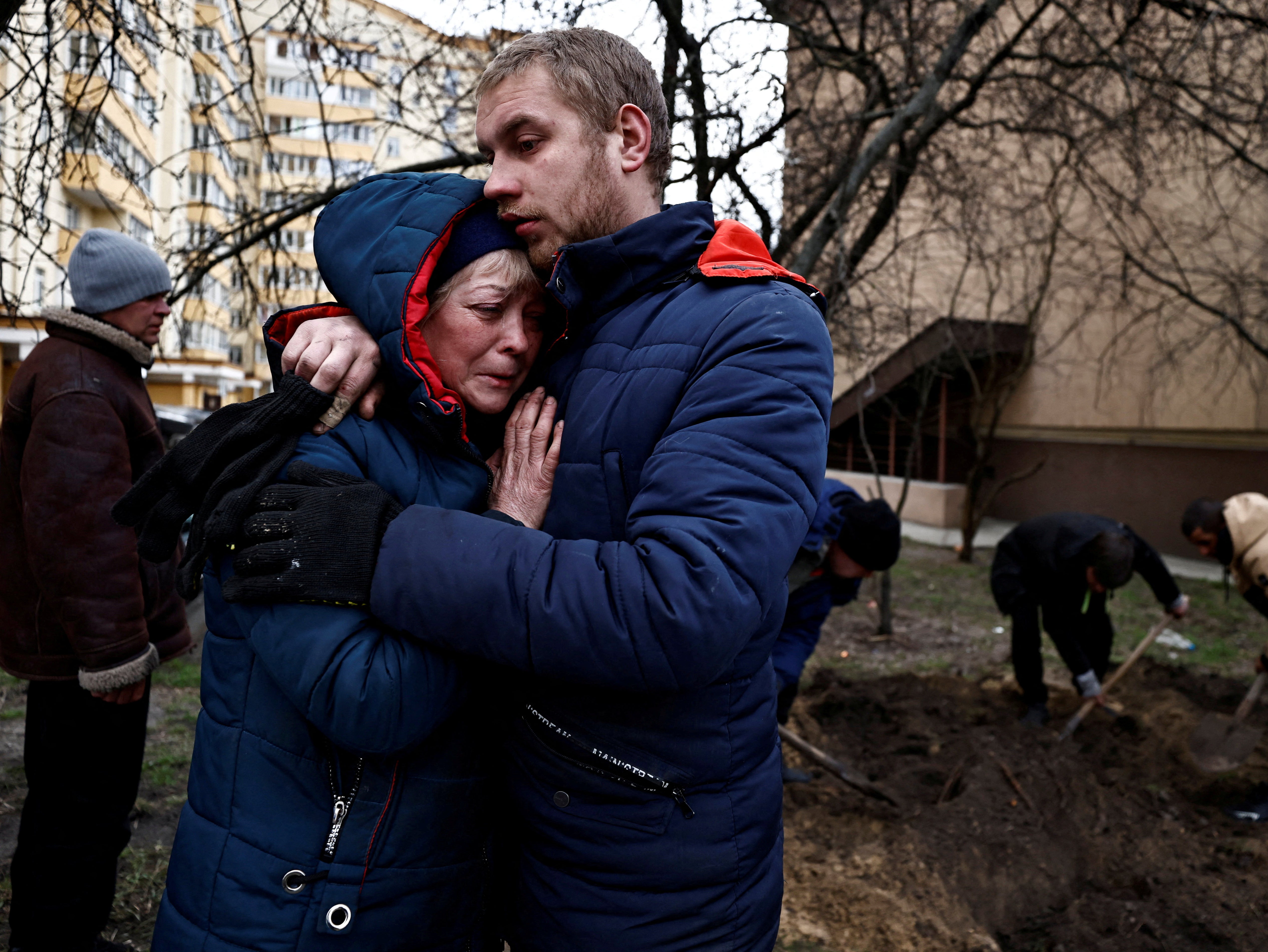 Serhii Lahovskyi, 26, hugs Ludmyla Verginska, 51, as they mourn their friend Ihor Lytvynenko, who according to residents was killed by Russian soldiers in Bucha