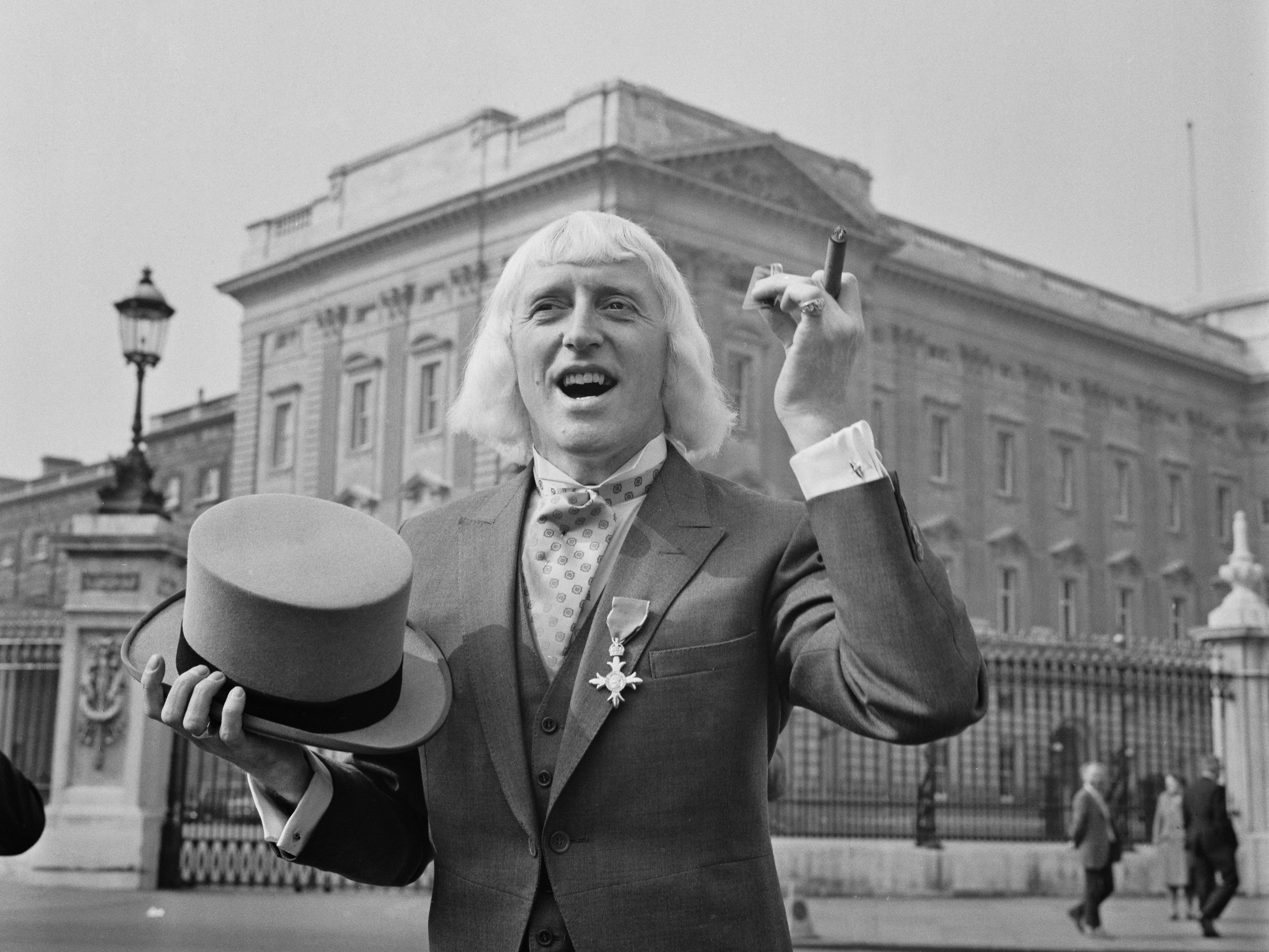 Jimmy Savile outside Buckingham Palace in London after receiving his OBE in 1972