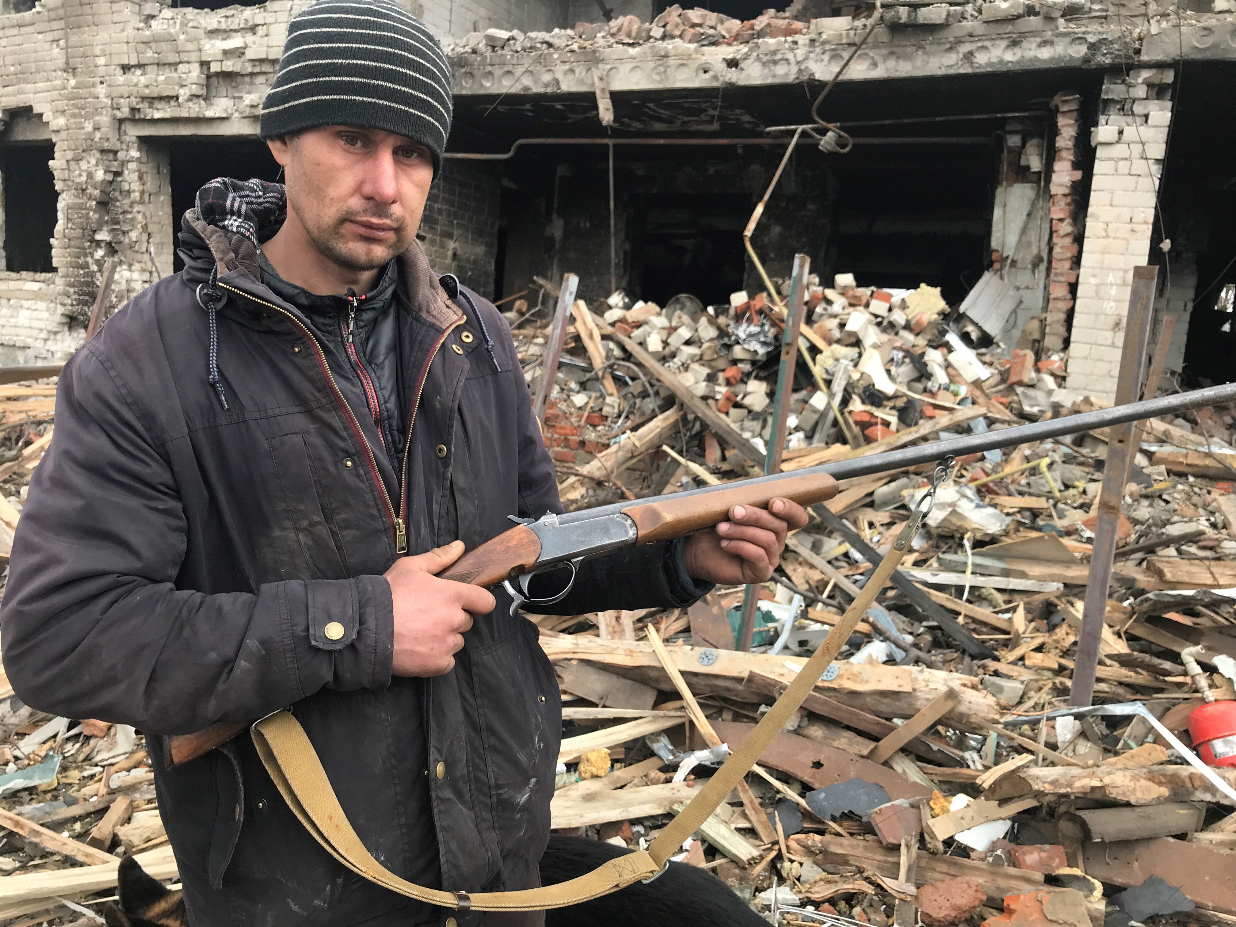 Anton Ryzyk in front of what is left of his house