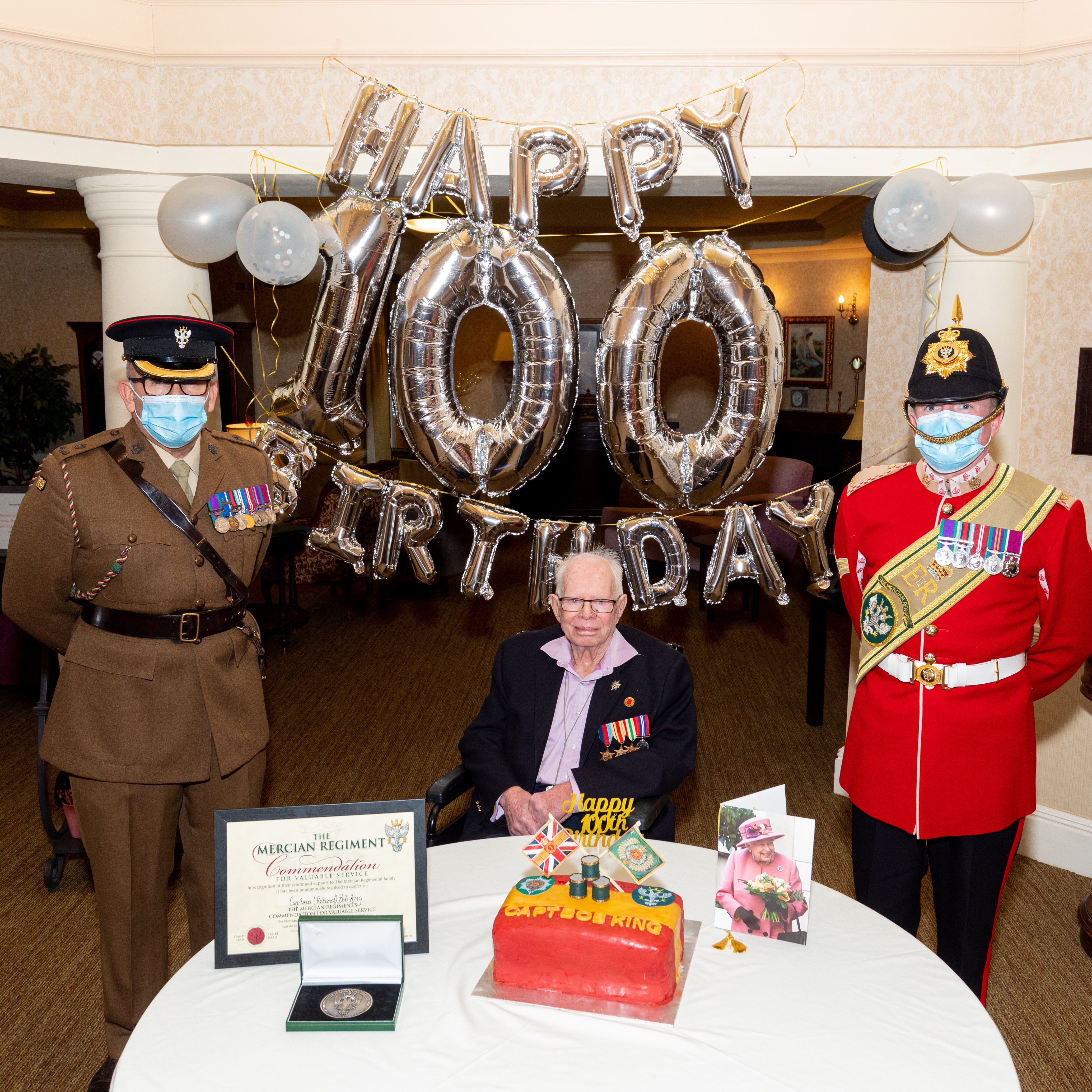 Bob King celebrated with Major Peter Lewis and Corporal Phillip Thornton (Shaun Fellows/Shine Pix/PA)