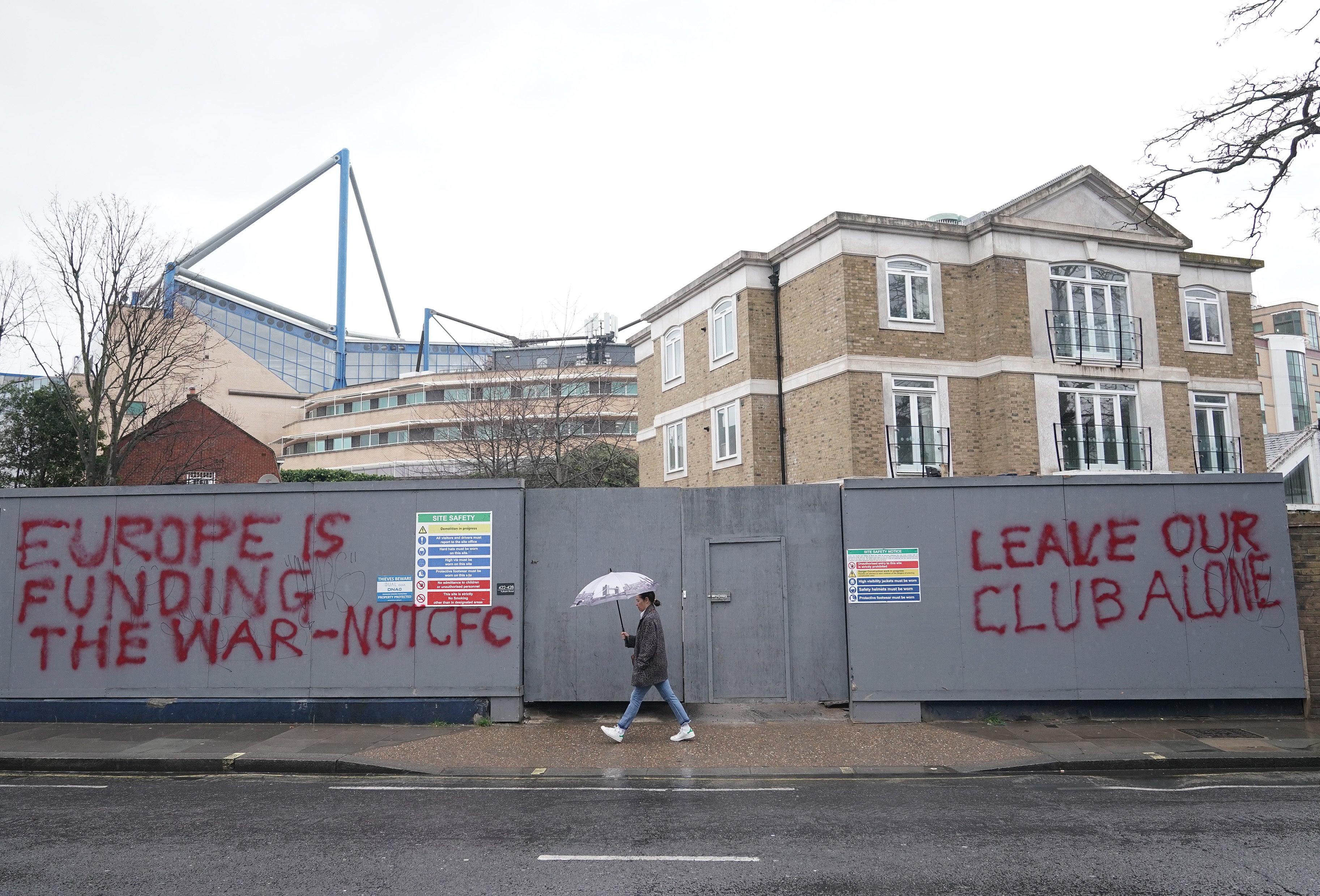 Graffiti close to Stamford Bridge shows supporter frustration with the Chelsea sale (Yui Mok/PA)