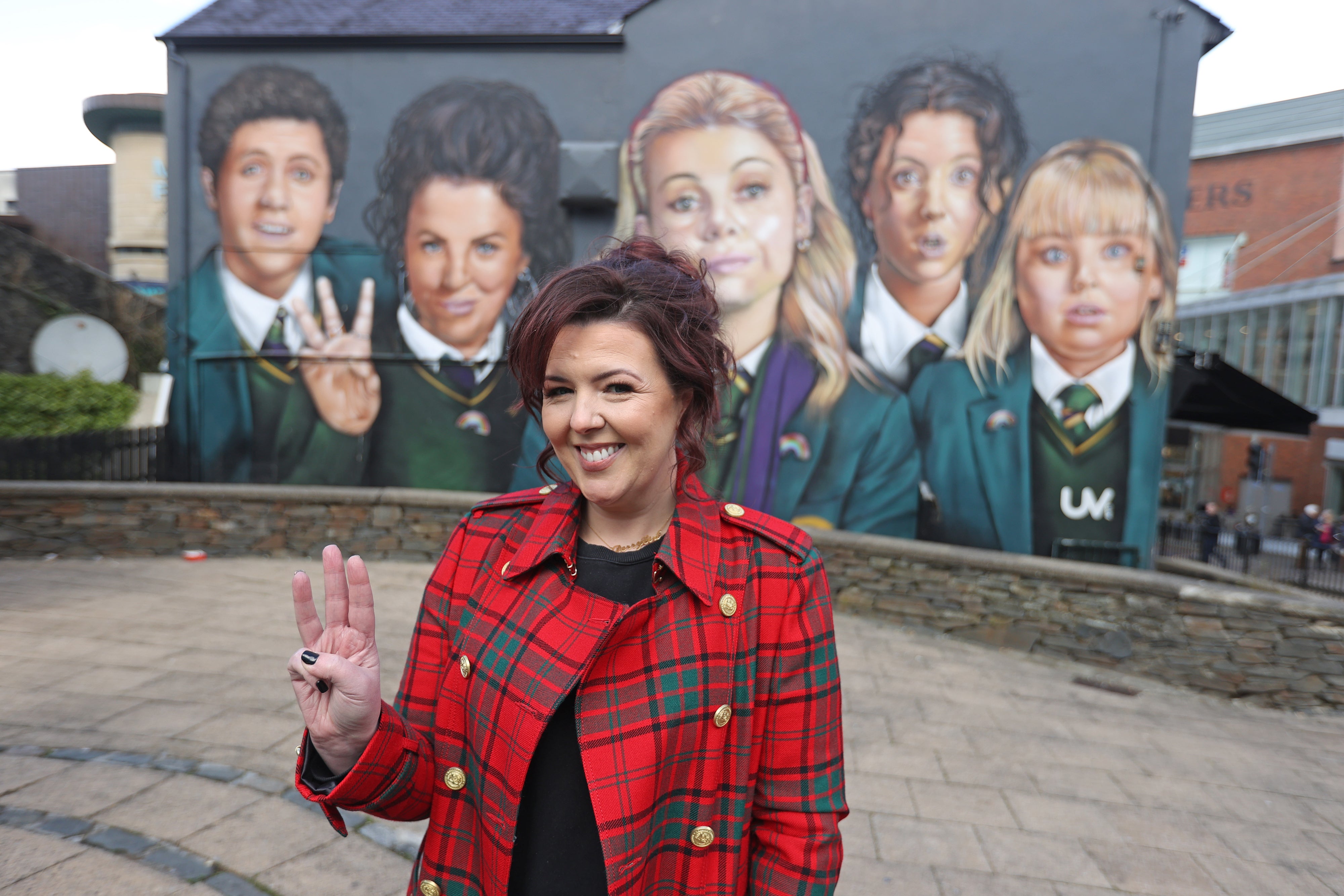 Derry Girls writer Lisa McGee at a mural inspired by the drama (Liam McBurney/PA)