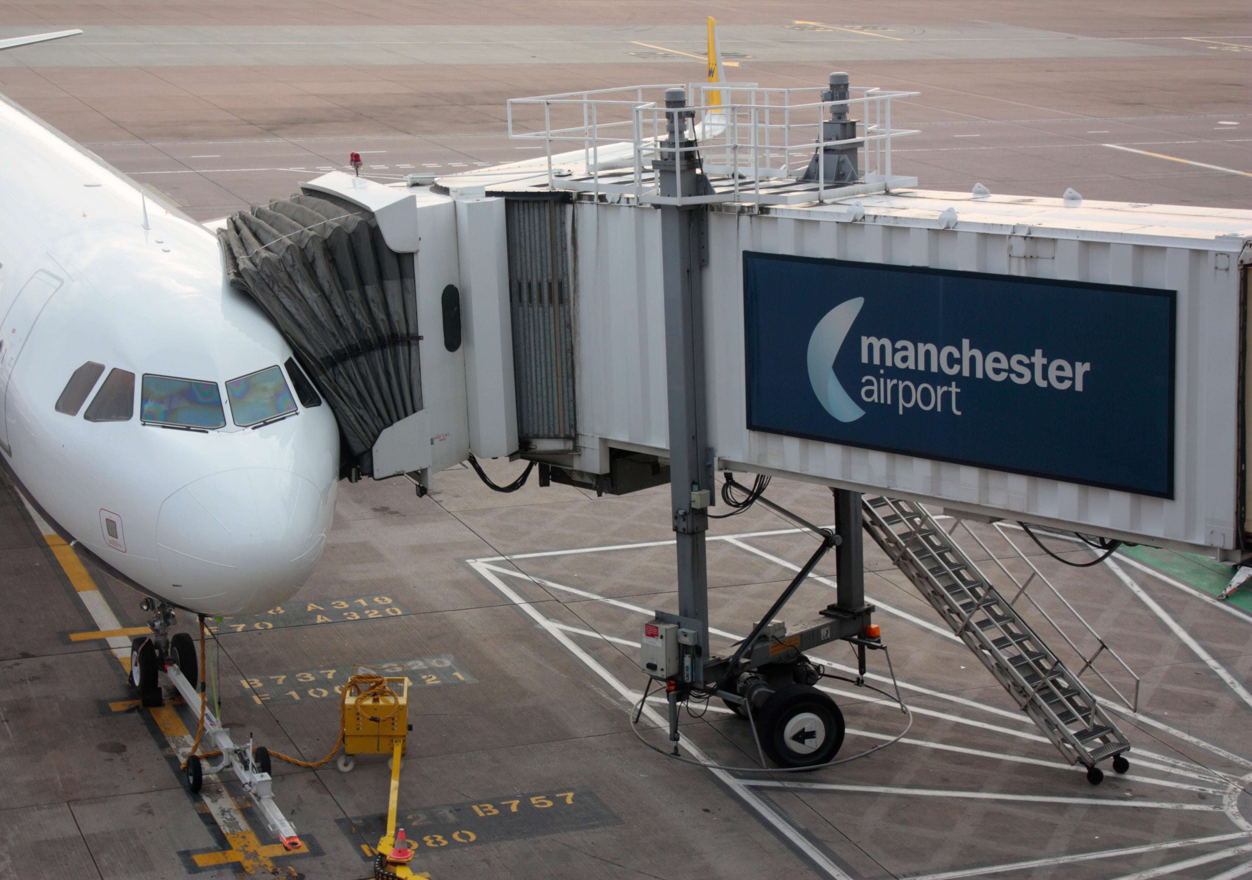 Manchester Airport has warned passengers they will face queues of up to 90 minutes this summer as it does not have enough staff (Alamy Stock Photo/PA)