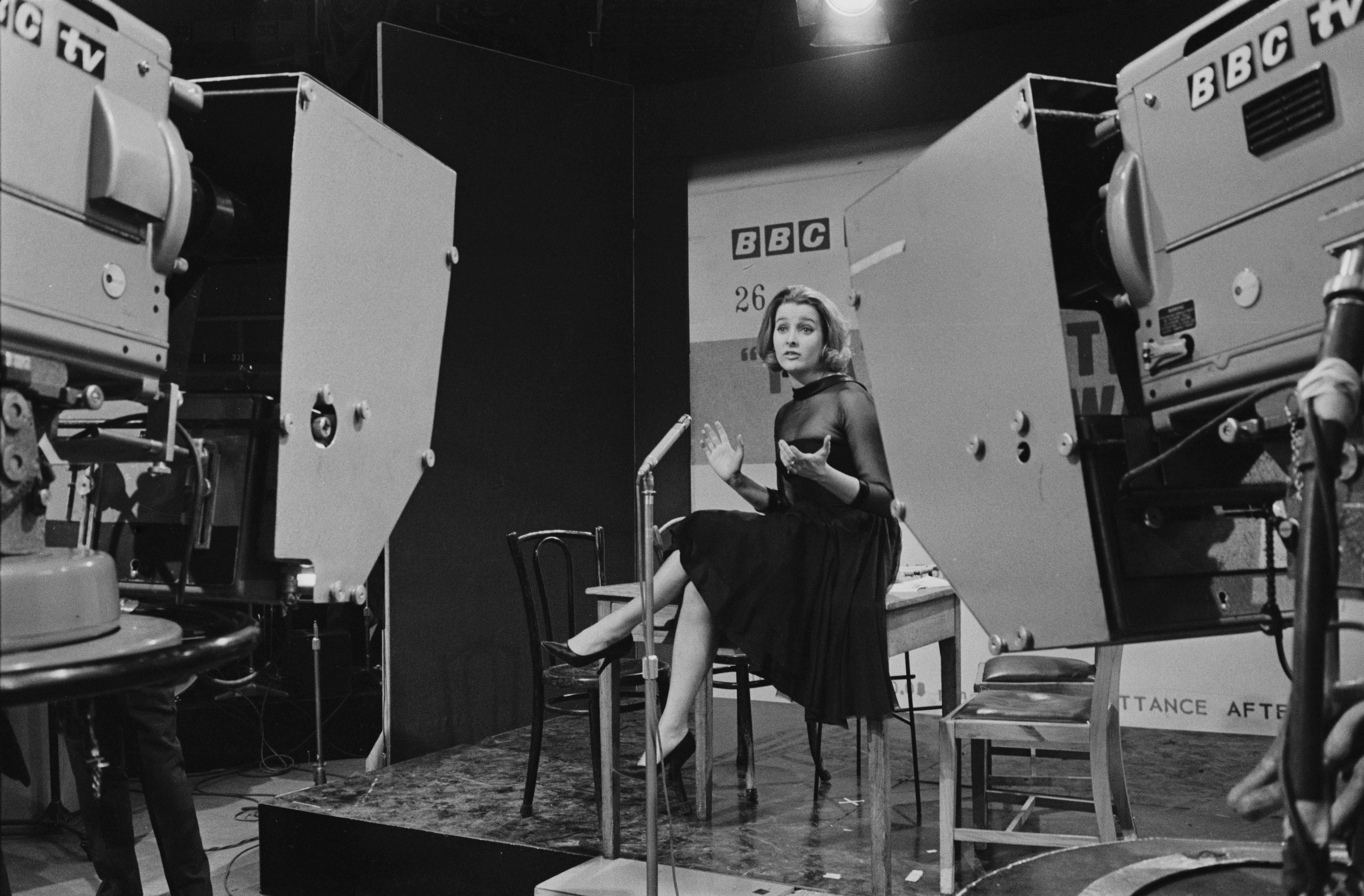 English actress, singer, and comedian Millicent Martin rehearsing on the set of satirical television programme ‘That Was the Week That Was’