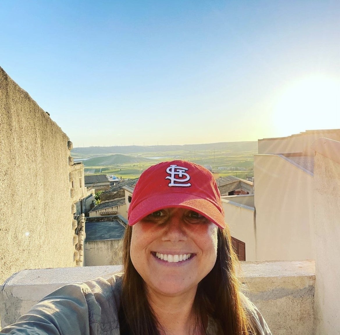 Meredith in front of the view from her property