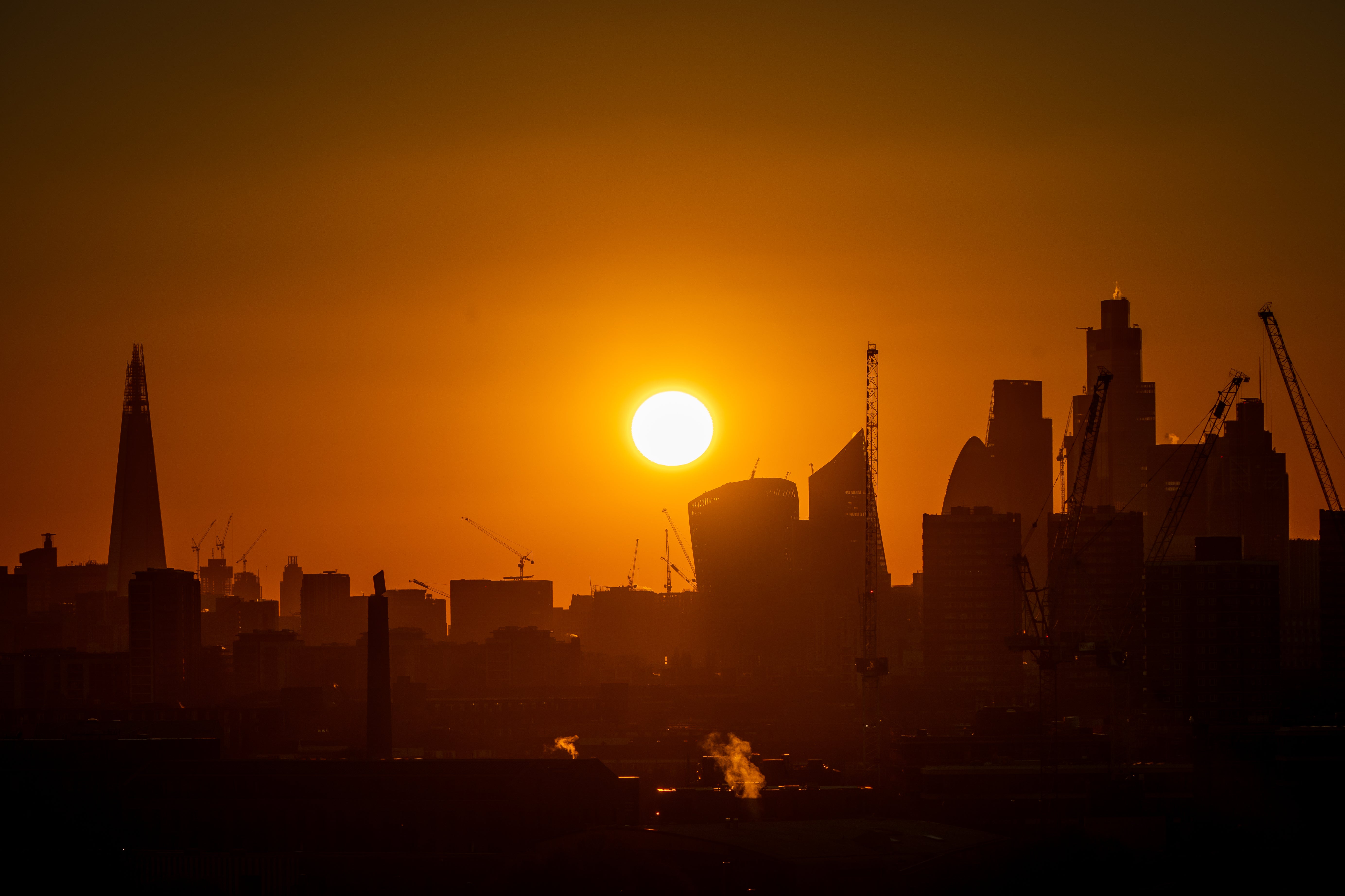 The FTSE 100 closed up as investors took advantage of a weak pound to buy UK shares (Aaron Chown/PA)