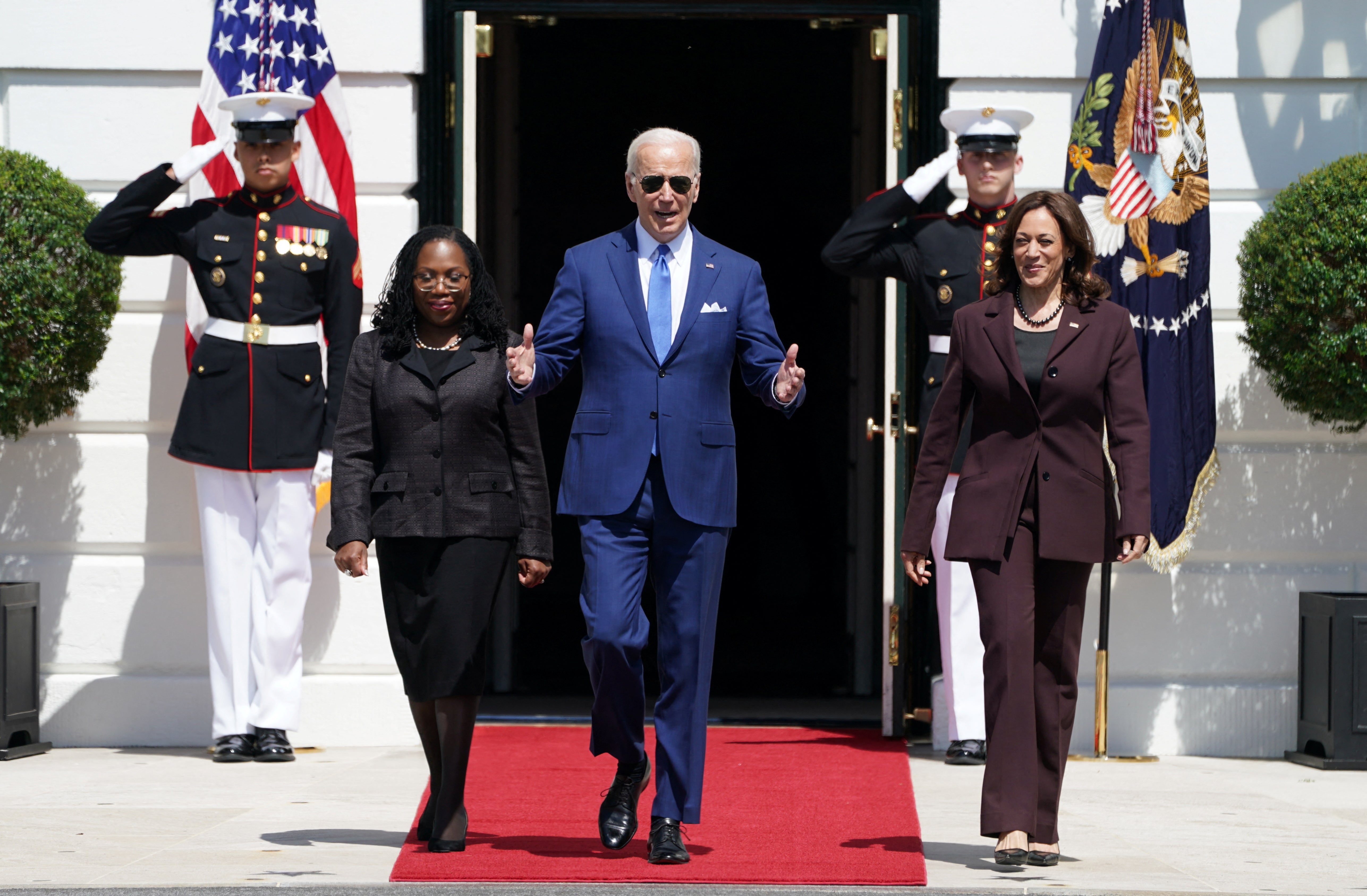 U.S. President Joe Biden walks out of the South Portico of the White House with Judge Ketanji Brown Jackson and Vice President Kamala Harris as they arrive for a celebration of Judge Jackson?s confirmation as the first Black woman to serve on the U.S. Supreme Court, on the South Lawn at the White House in Washington, U.S., April 8, 2022. REUTERS/Kevin Lamarque