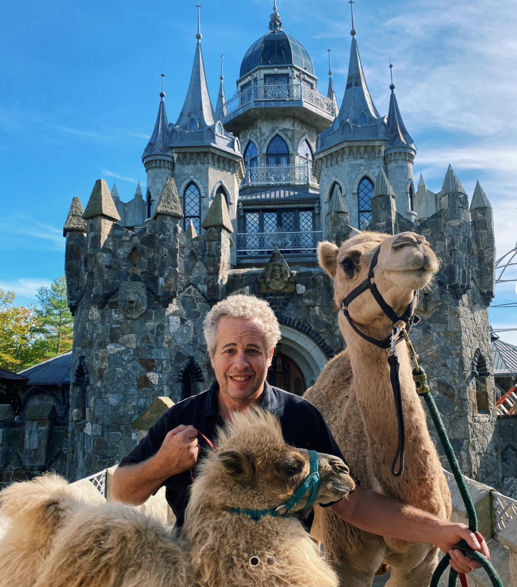 Chris Mark with two of his pet camels who used to live on the grounds of the castle