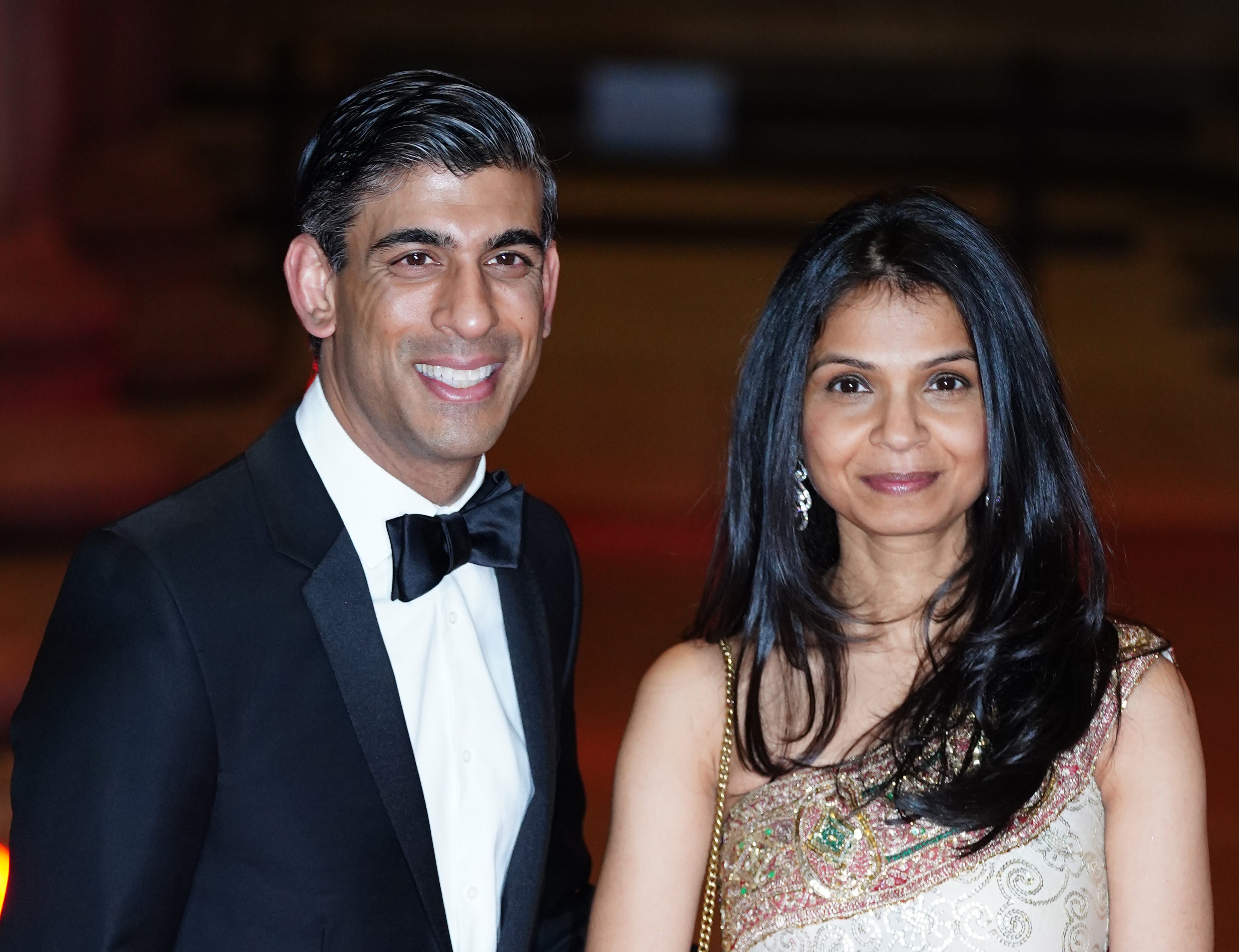 Chancellor Rishi Sunak alongside his wife Akshata Murty (Ian West/PA)