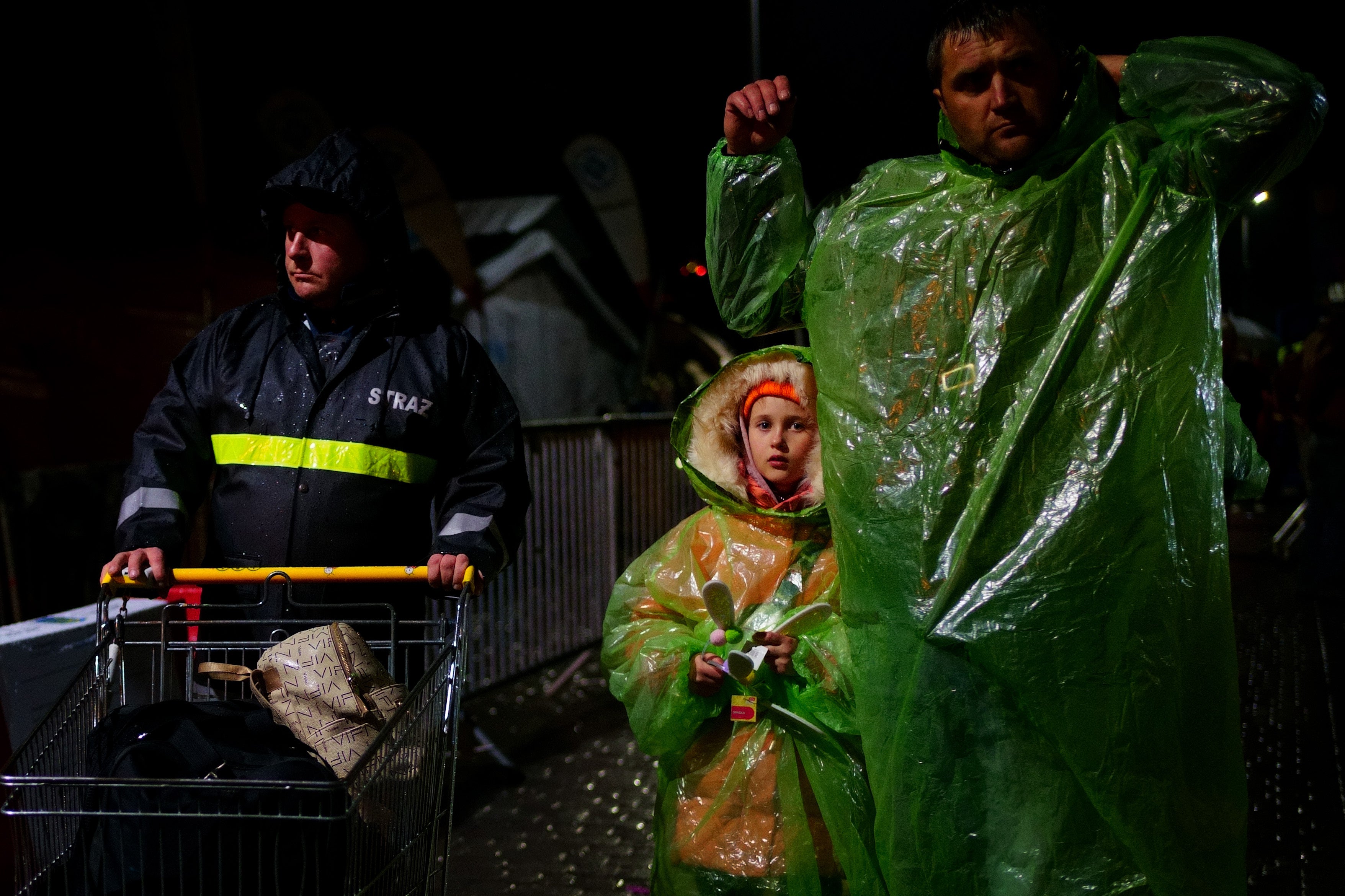 A family of Ukrainian refugees cross the border point from Ukraine into Medyka, Poland (Victoria Jones/PA)