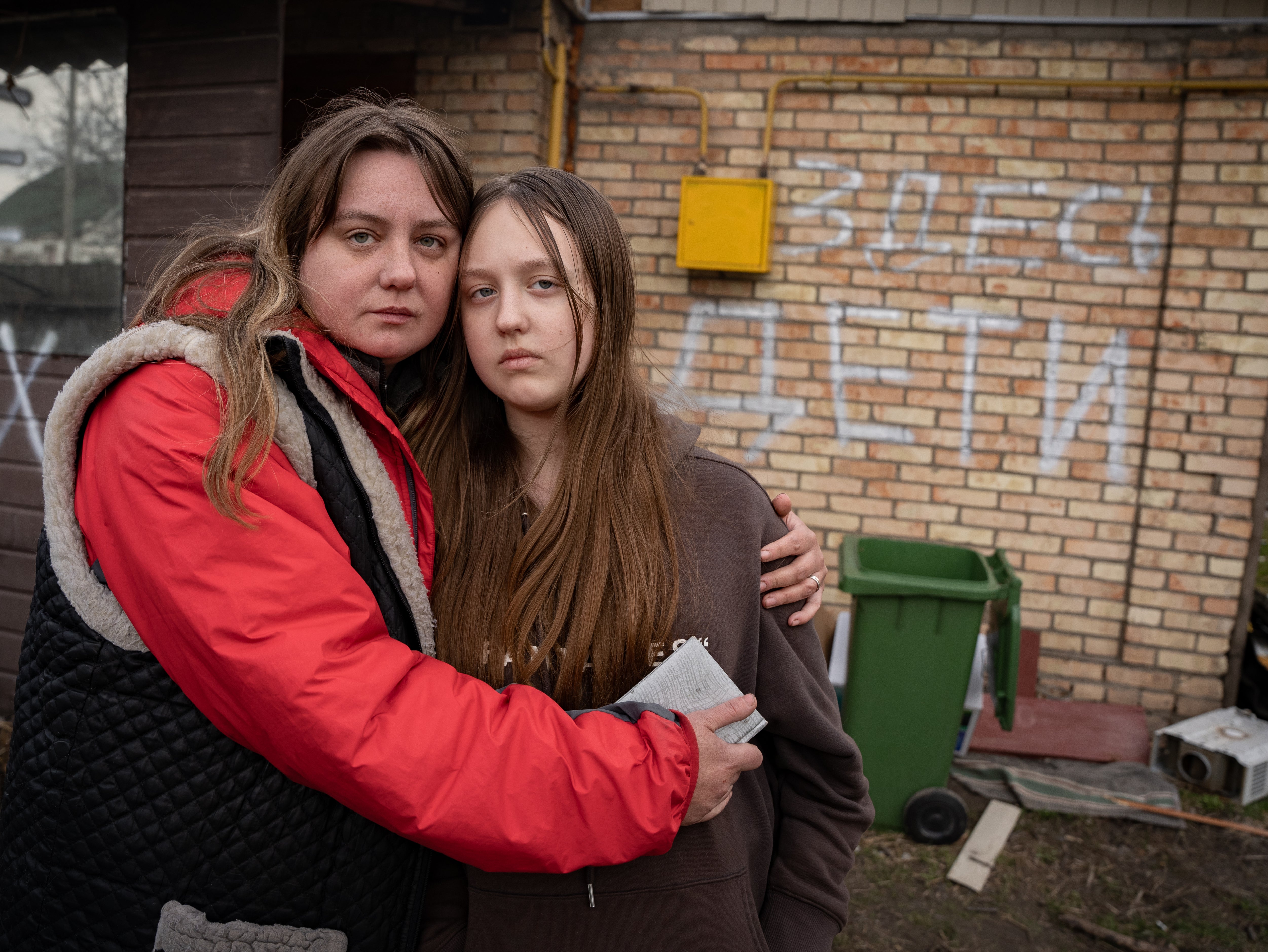 A family in Hostomel wrote ‘children here’ in Russian on their building, hoping it would protect them