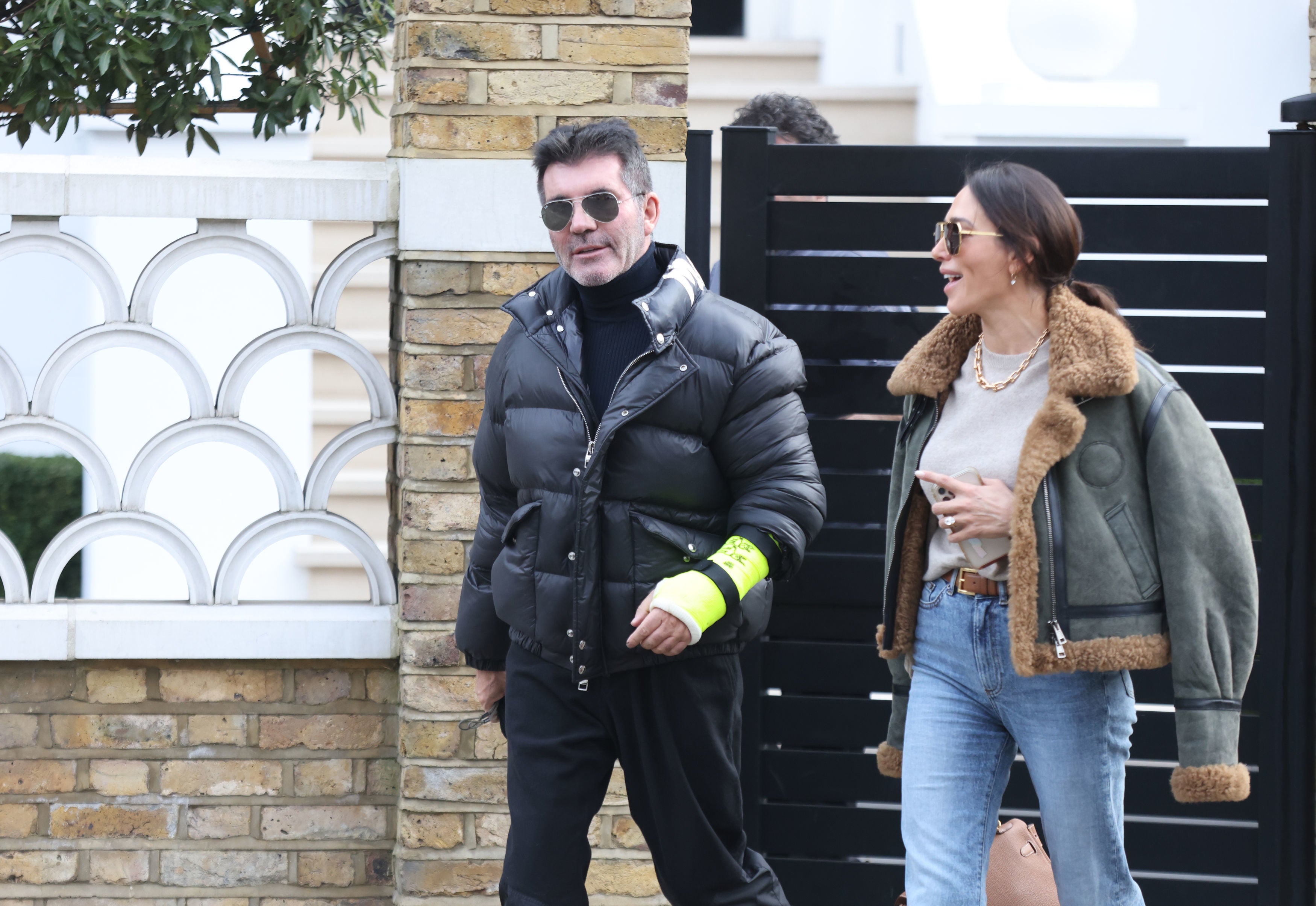 Simon Cowell and Lauren Silverman near their home in Holland Park, London