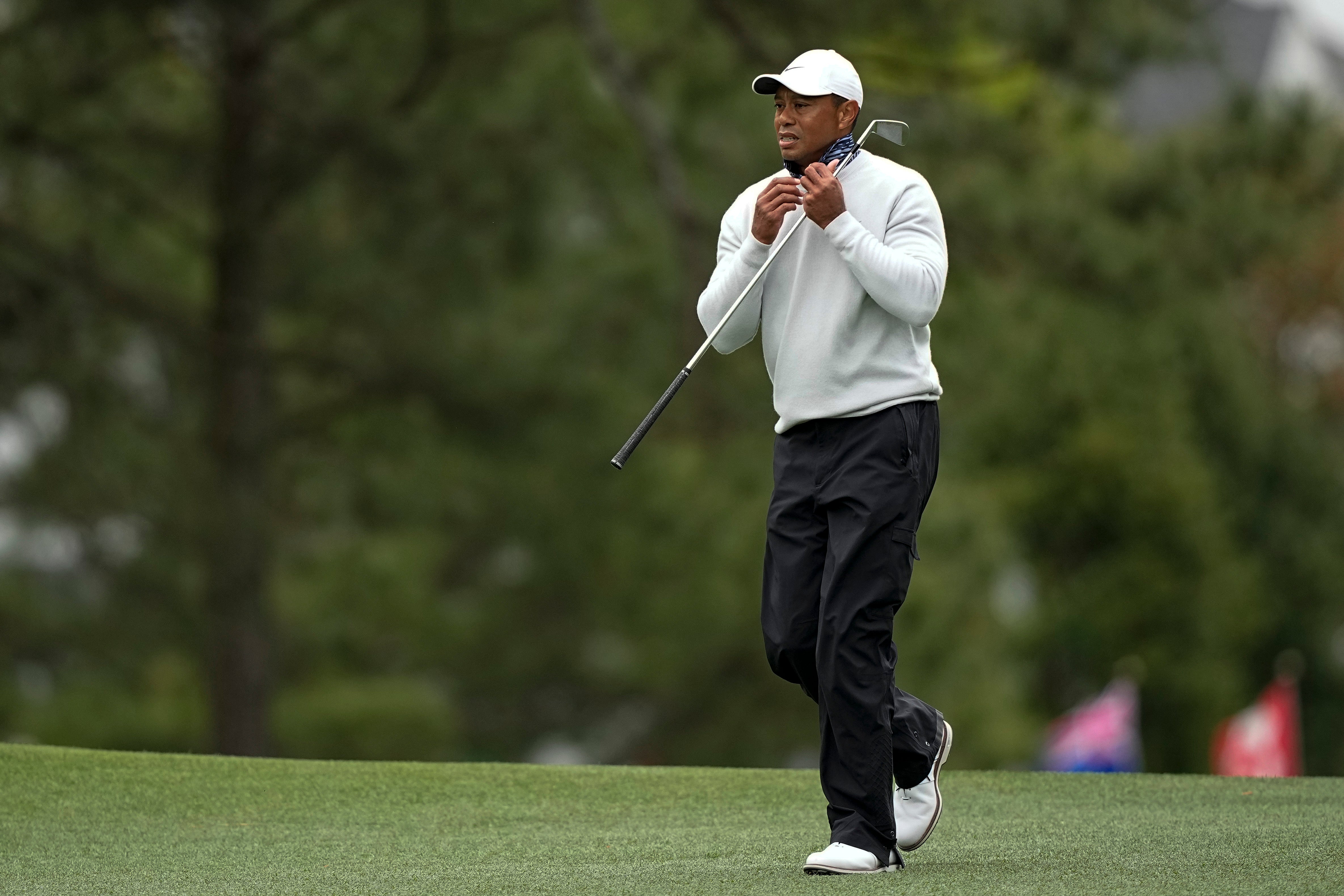 Tiger Woods walks down the first fairway during the third round of the Masters (David J. Phillip/AP)