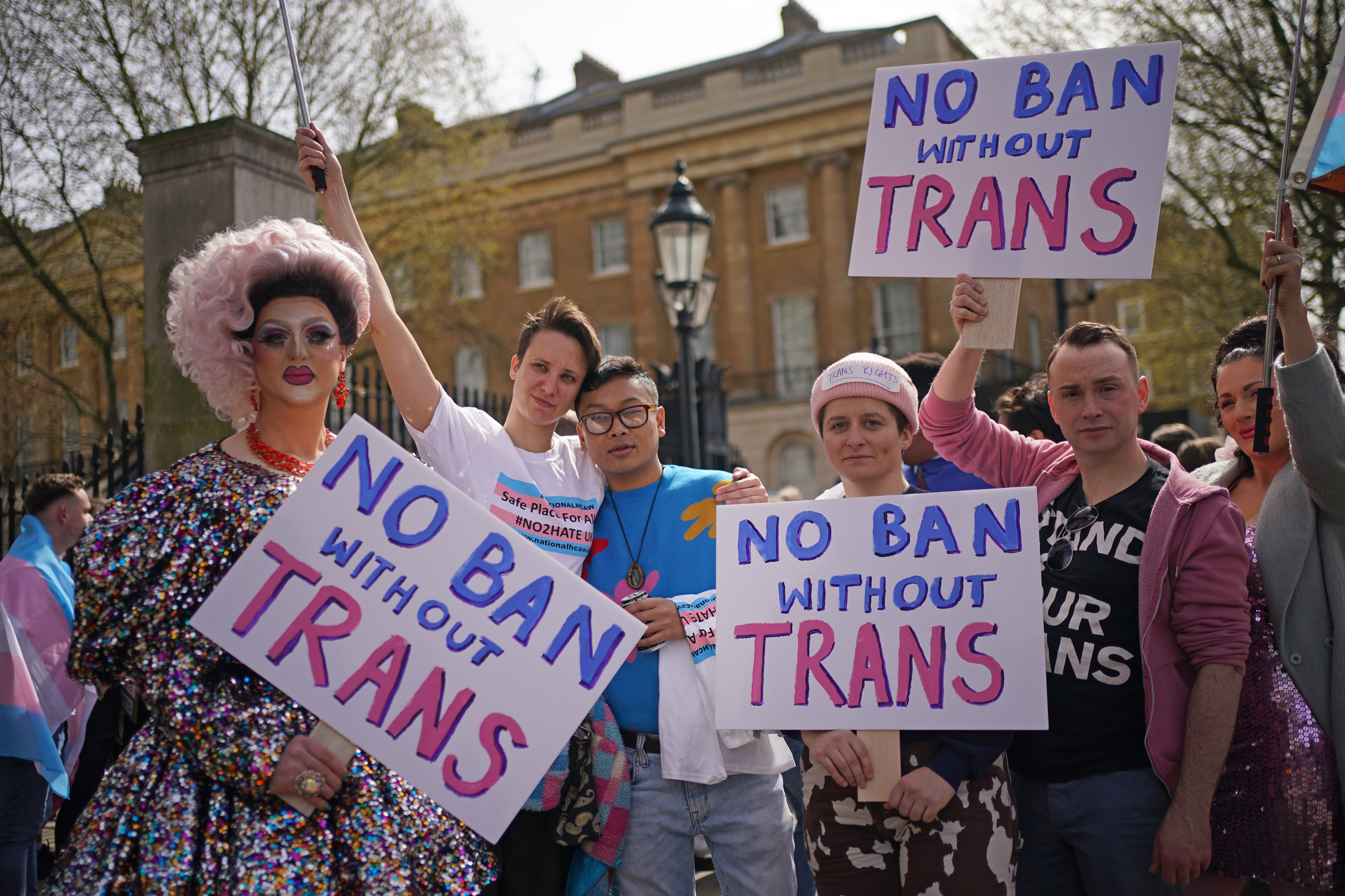 People take part in a protest over transgender people not being included in plans to ban conversion therapy (Yui Mok/PA)