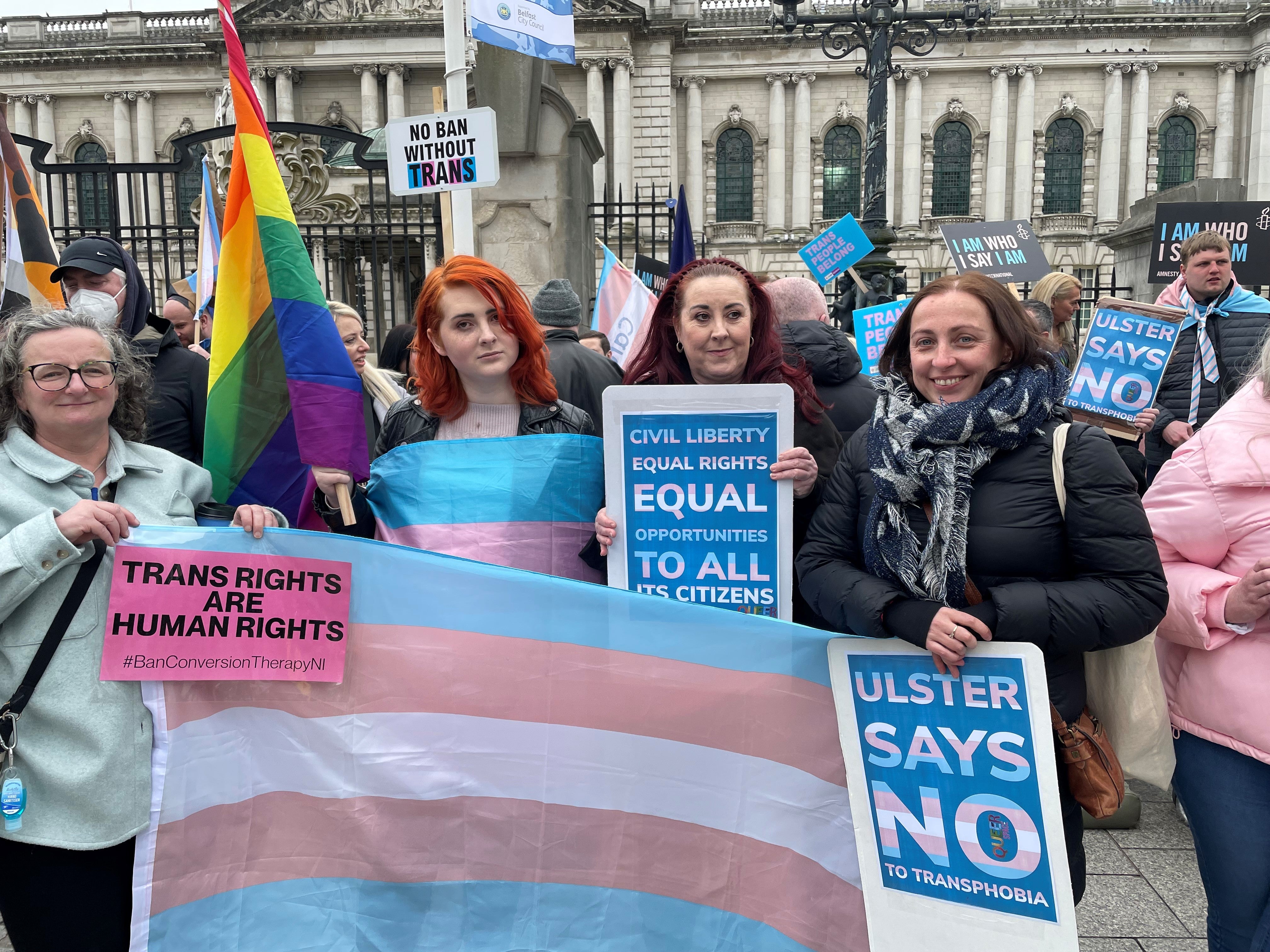 Protesters take part in a rally at Belfast City Hall (Jonathan McCambridge/PA)