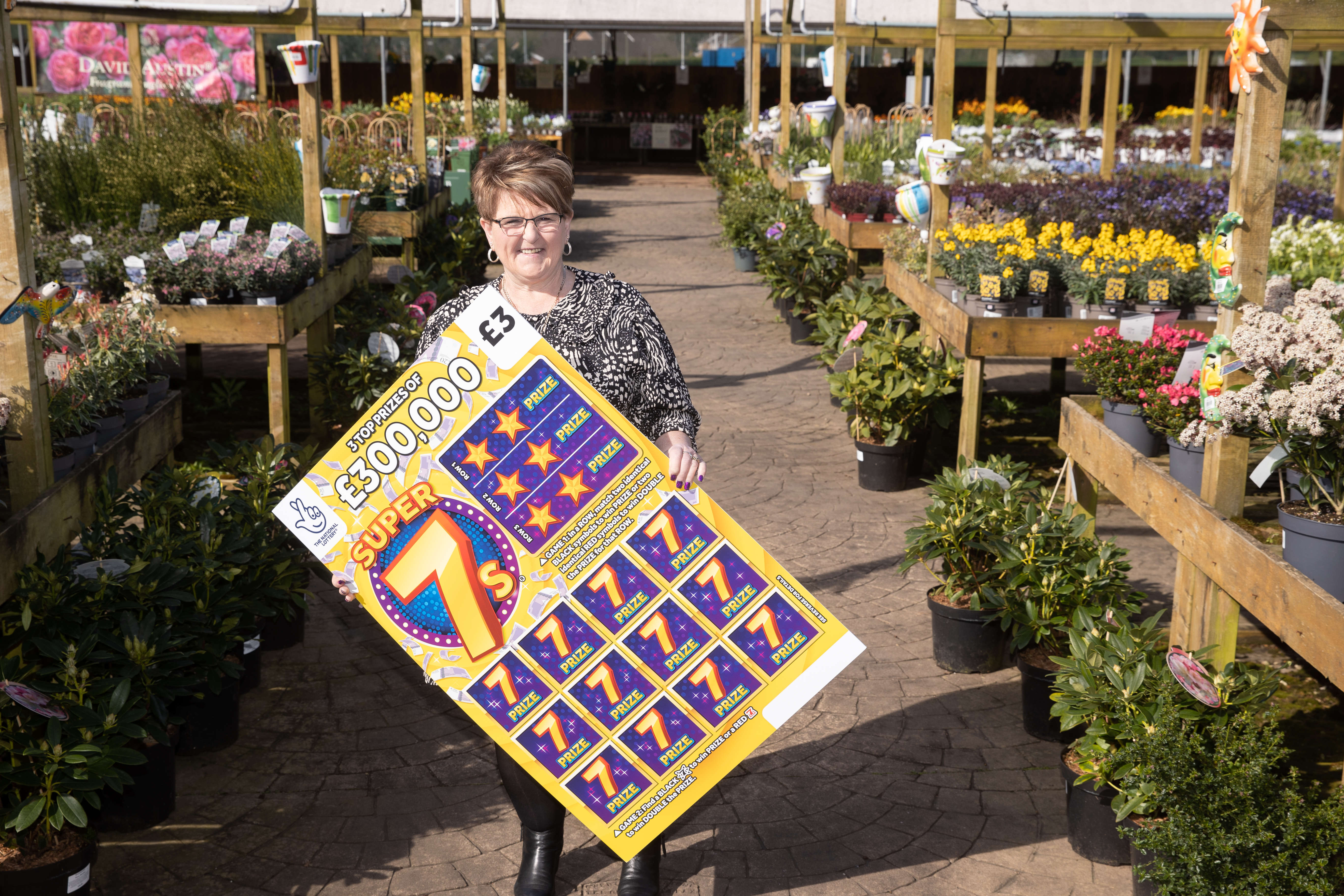 Caroline Walsh, 58, celebrates winning £300,000 on the National Lottery Scratchcard (Steve Pope/Fotowales)