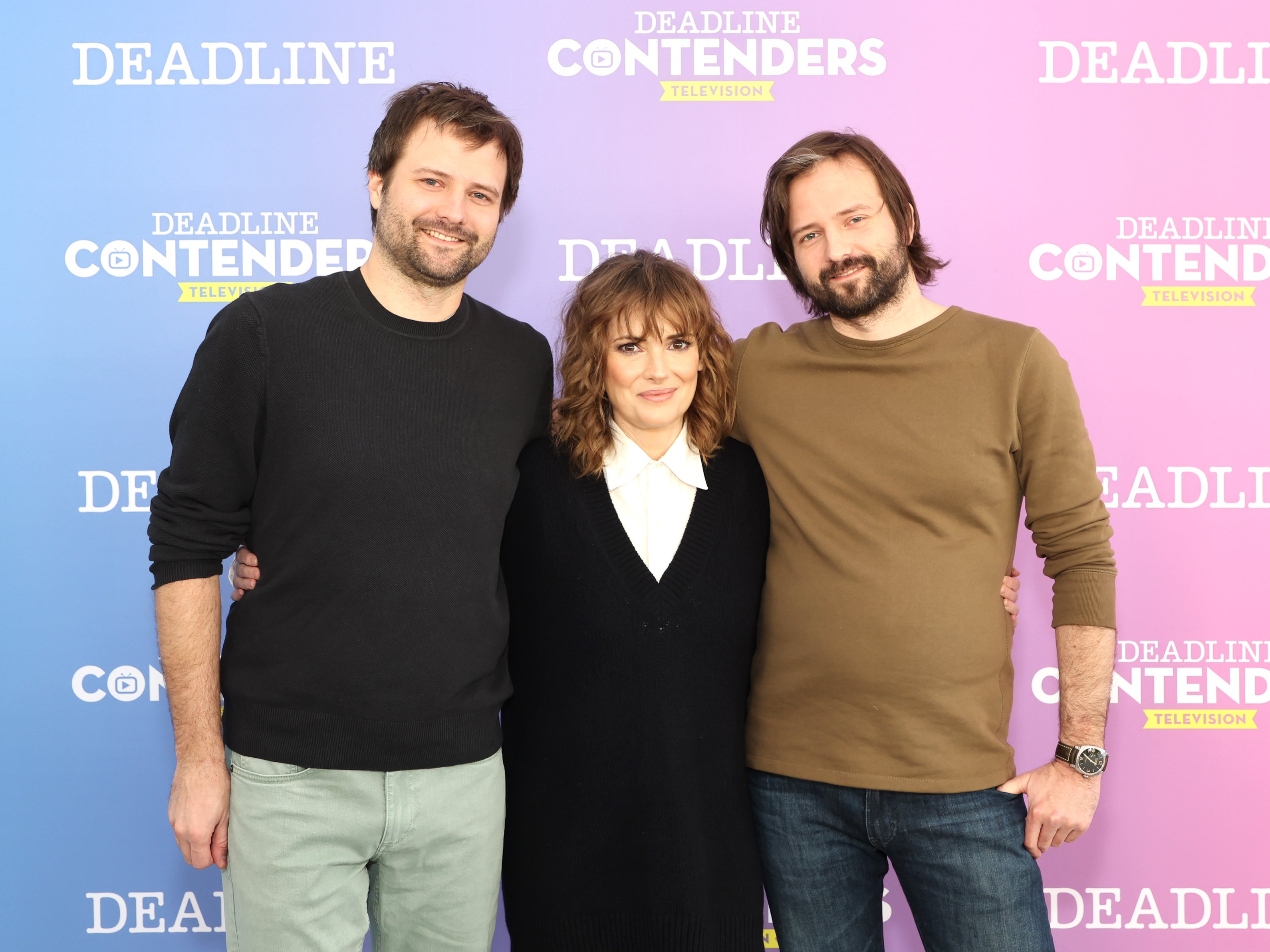 Winona Ryder (centre) with (L-R) Ross Duffer and Matt Duffer