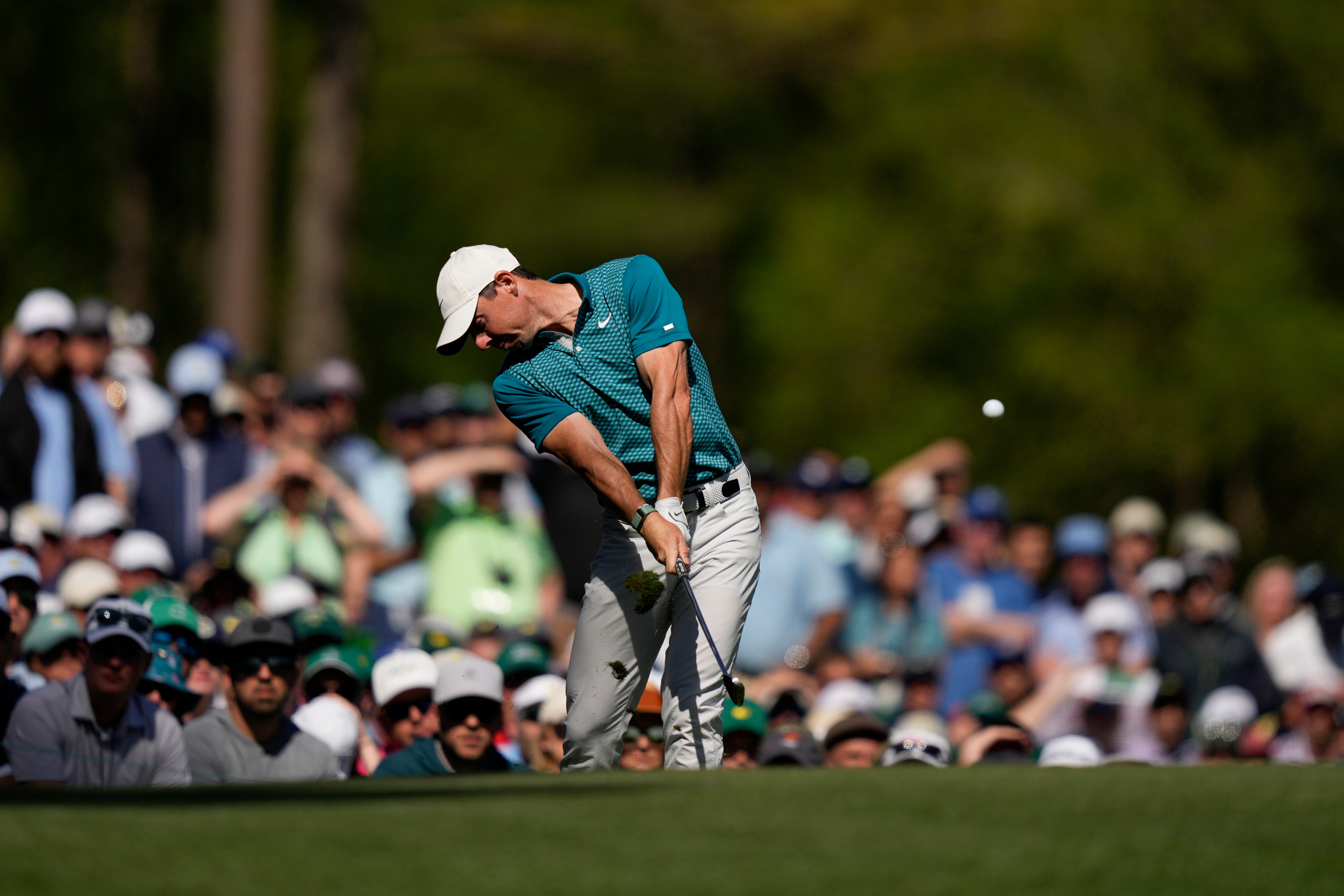 Rory McIlroy tees off on the 12th hole during the final round of the Masters (Matt Slocum/AP)