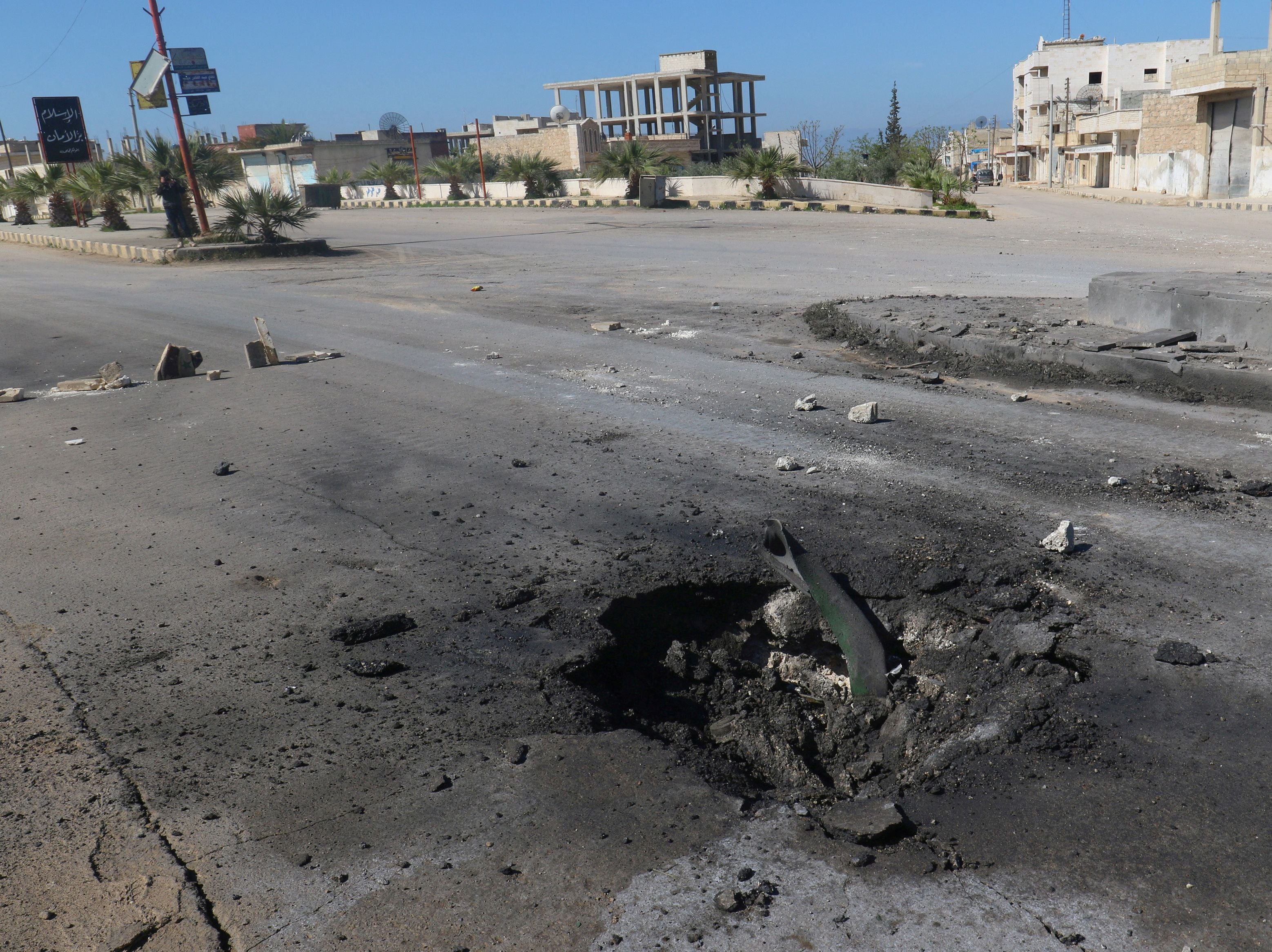 A crater is seen at the site of an airstrike, after what rescue workers described as a suspected gas attack in the town of Khan Sheikhoun, Syria, on 4 April 2017