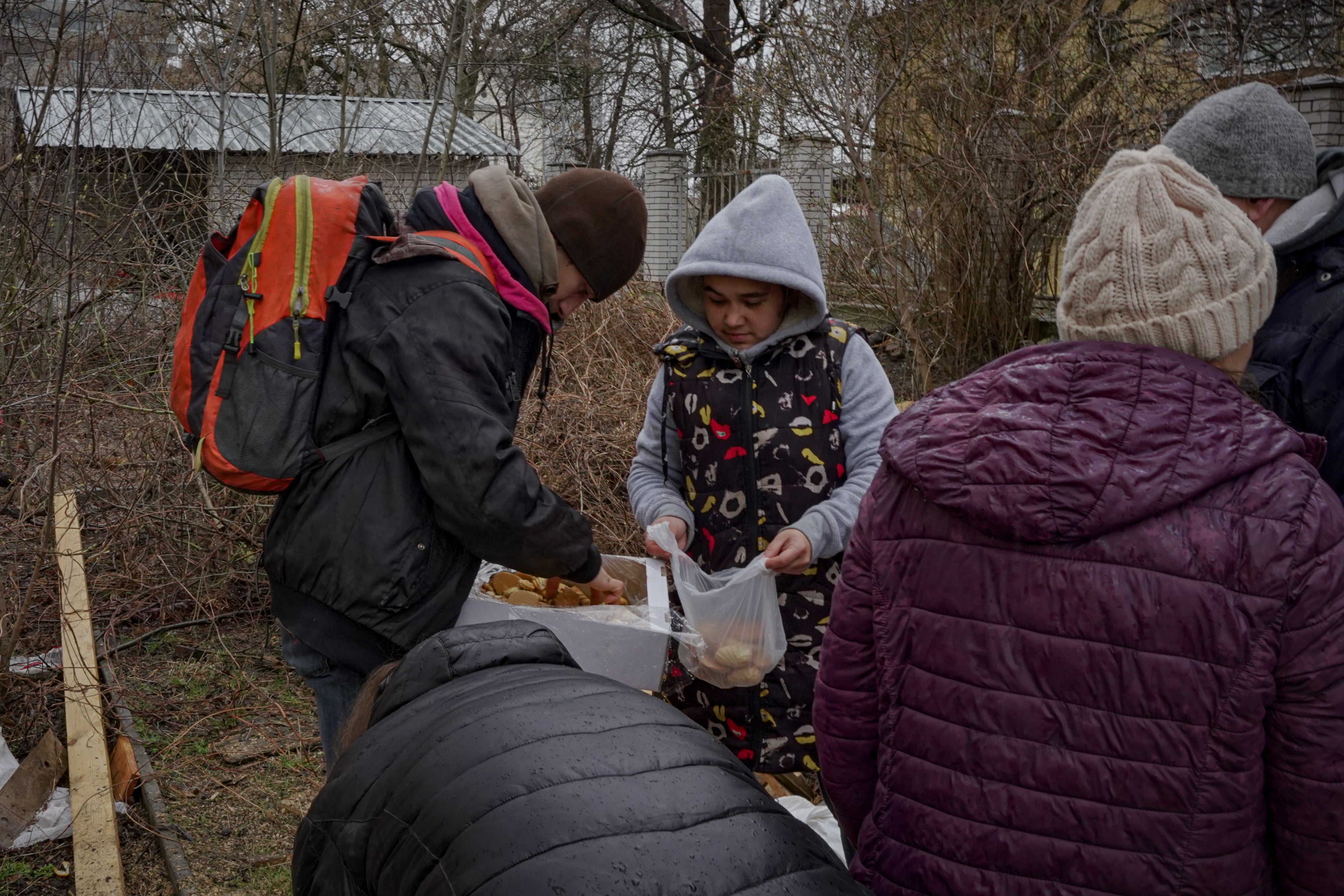 Chernihiv residents queue up to get food supplies form the charity’s main base