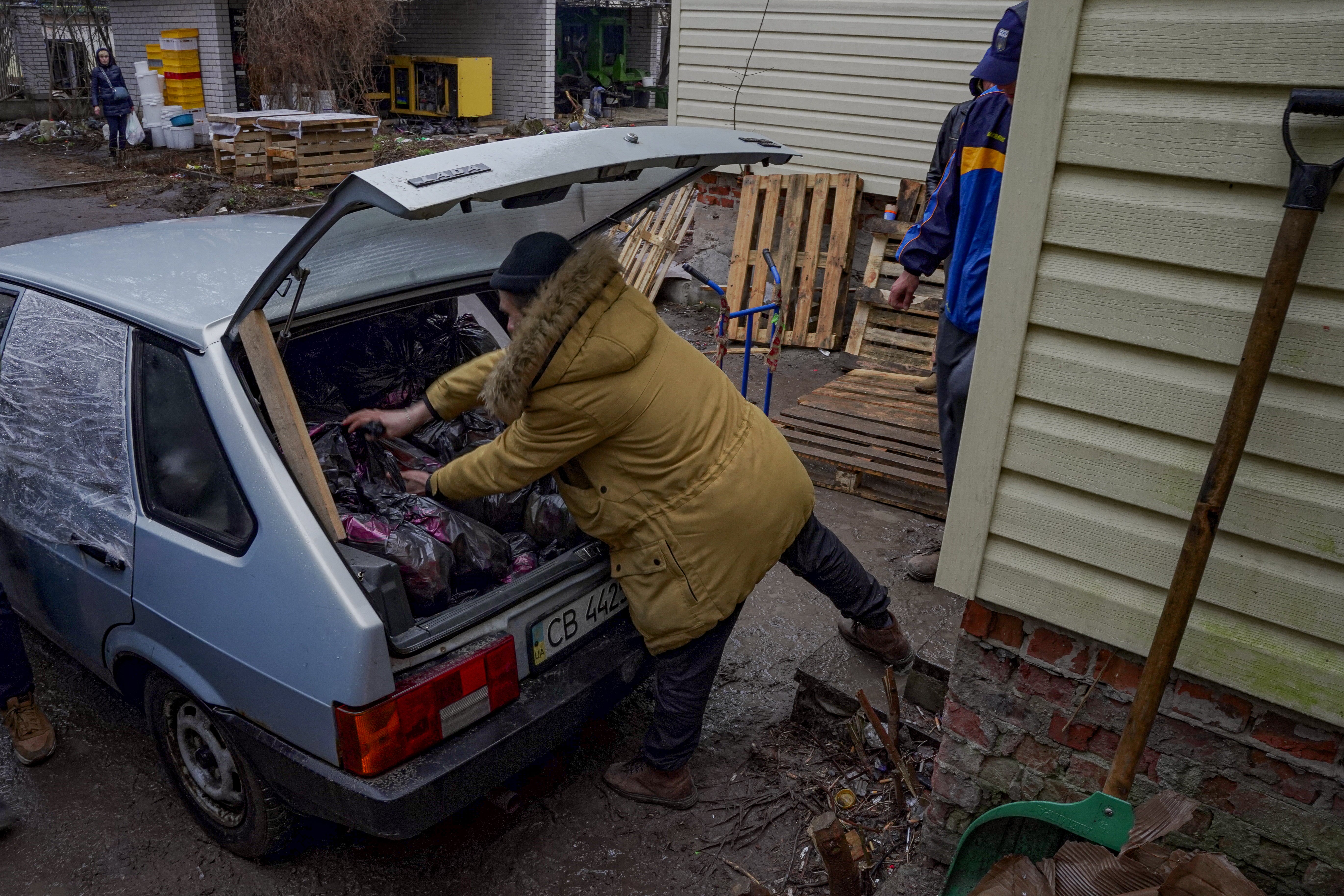 Volunteers load up a car ready to make a delivery