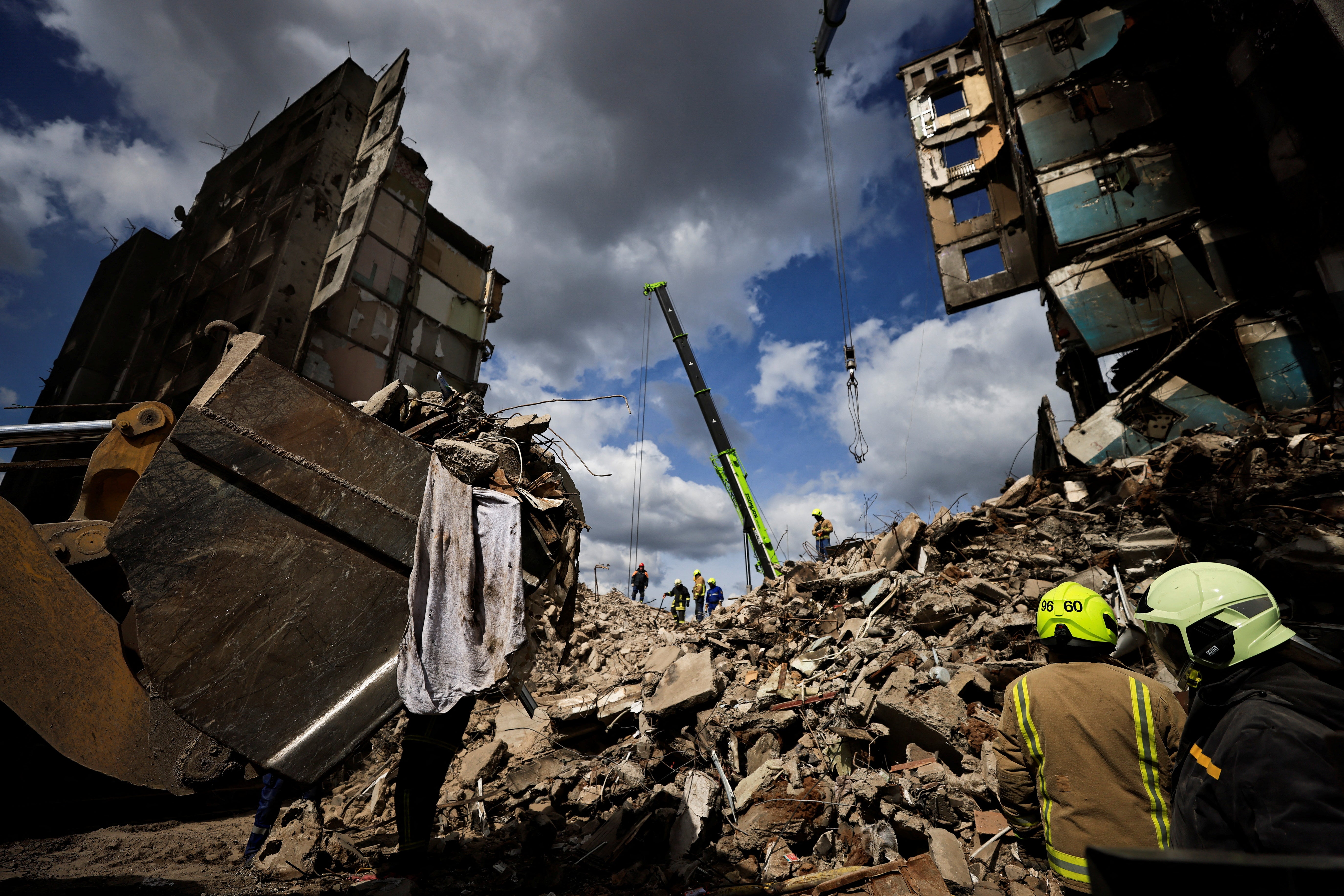 Elsewhere, rescuers search for bodies under the rubble of a building destroyed by Russian shelling in Borodyanka, Kyiv region