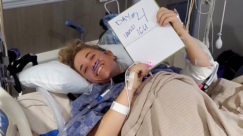 Jordan Hatmaker, 35, poses in the hospital in Suffolk, Virginia after a parachuting accident.