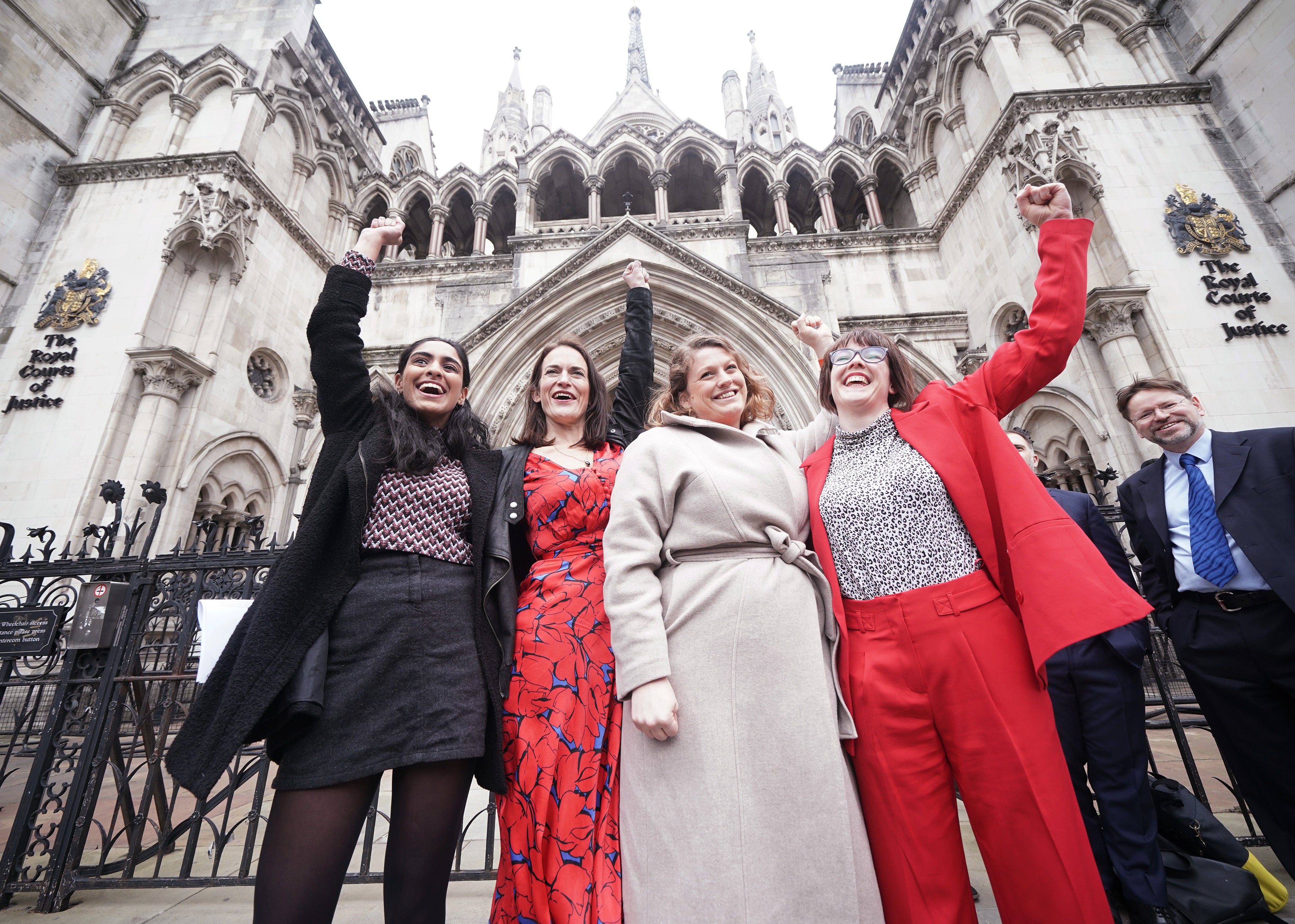 Reclaim These Streets founders (left to right) Henna Shah, Jamie Klingler, Anna Birley and Jessica Leigh celebrate outside the Royal Courts of Justice, London (Yui Mok/PA)