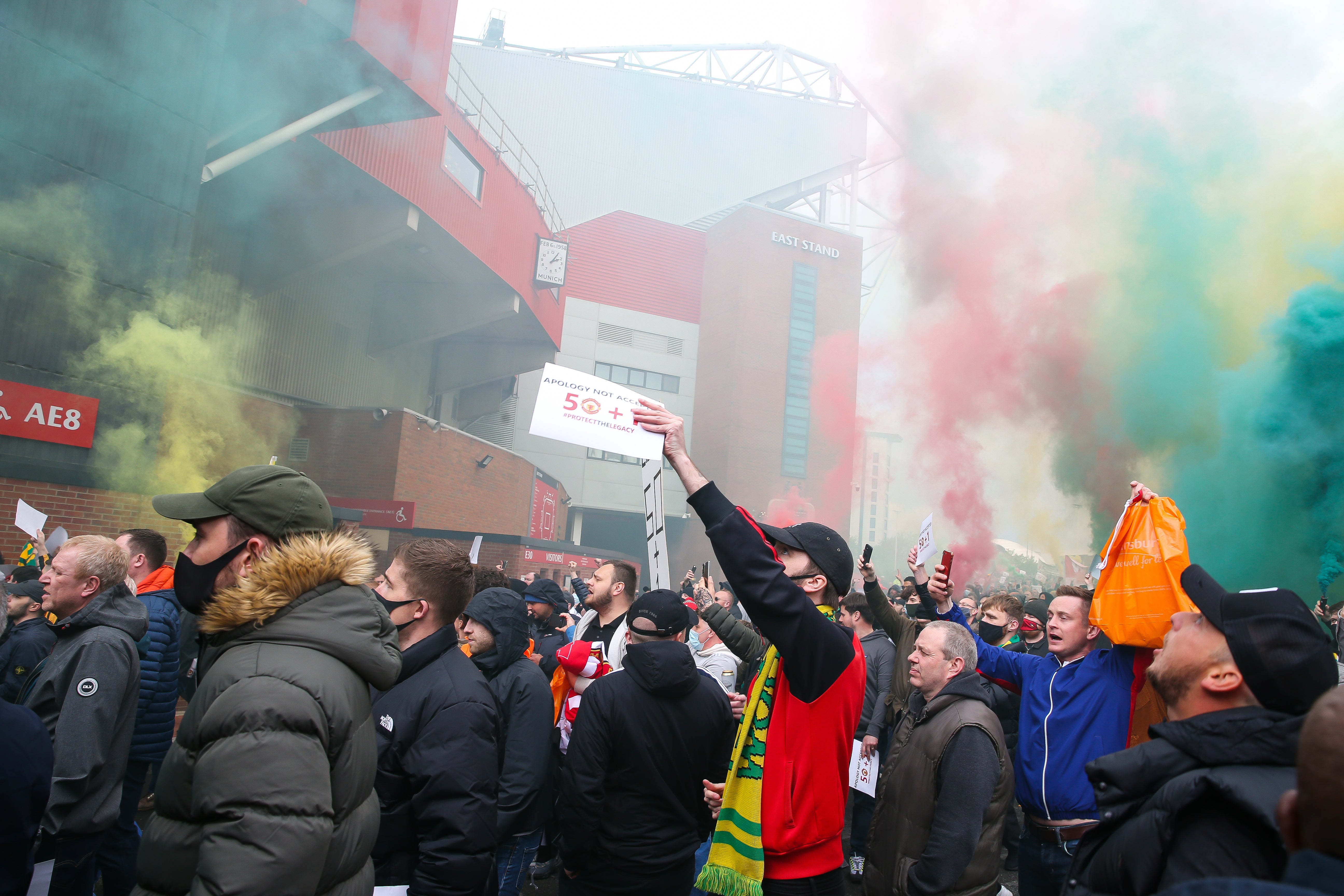 Manchester United fans protest at Old Trafford last April before breaking into the ground and forcing their game against Liverpool to be postponed (Barrington Coombs/PA)