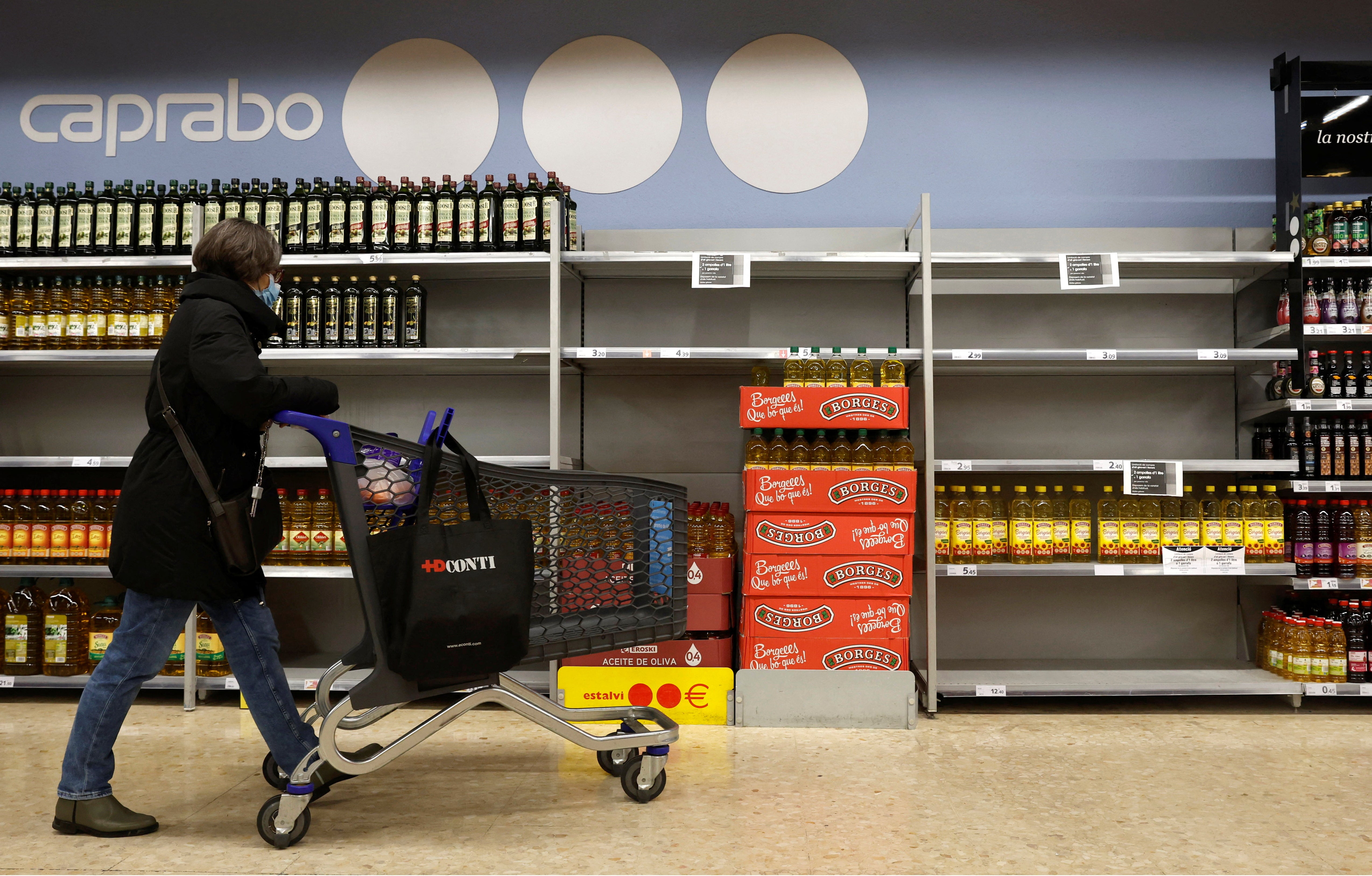 Empty shelves of sunflower oil, at a Caprabo supermarket in Barcelona, Spain