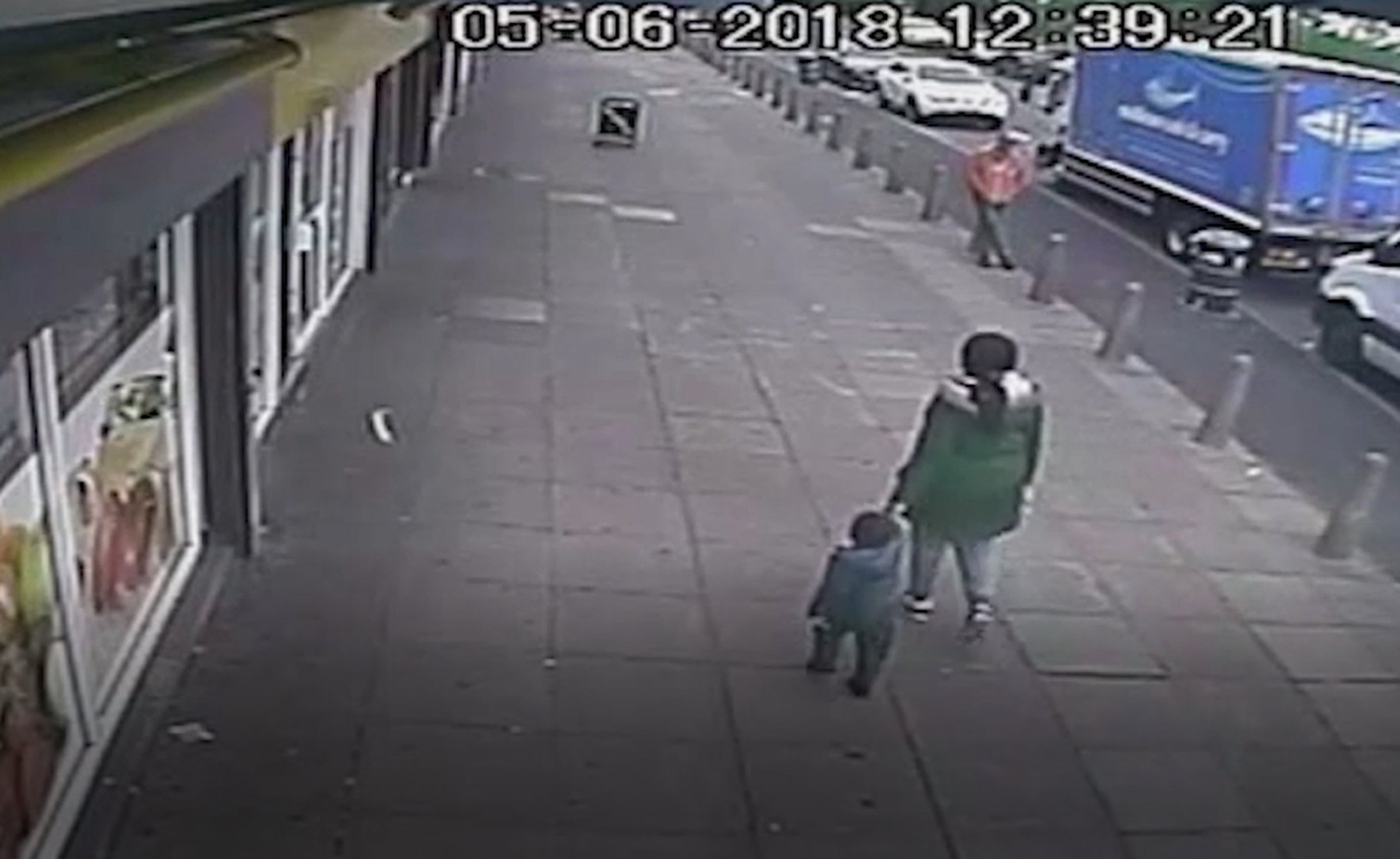 CCTV showing three-year-old Kemarni Watson Darby walking with his mother Alicia Watson past shops near her home in West Bromwich just hours before his murder (West Midlands Police/PA)