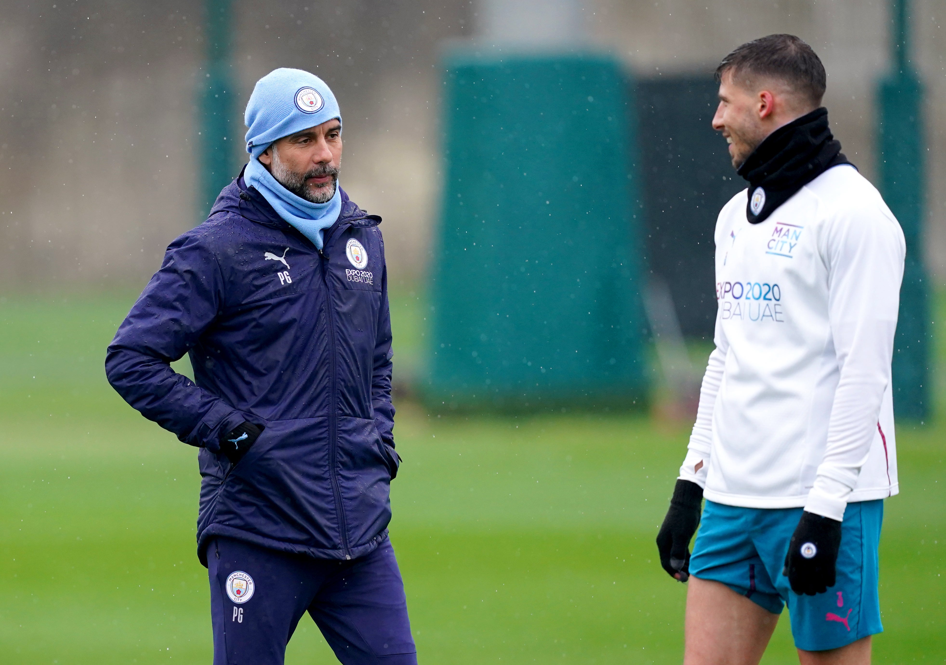 Guardiola (left) revealed Ruben Dias has recovered from injury and will travel to Spain (Martin Rickett/PA)