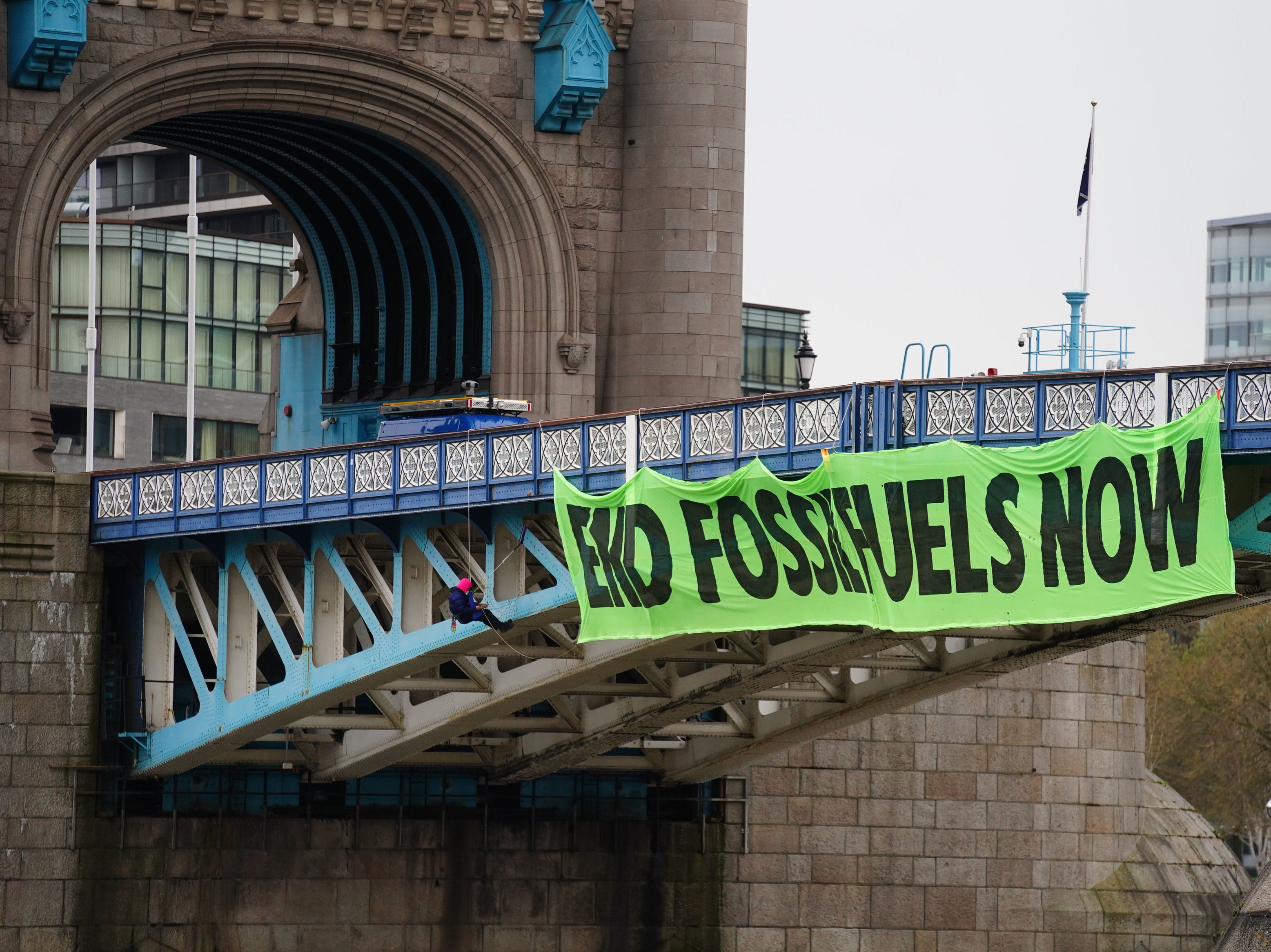 Activists closed Tower Bridge on Friday and suspended a giant banner reading ‘End Fossil Fuels Now’