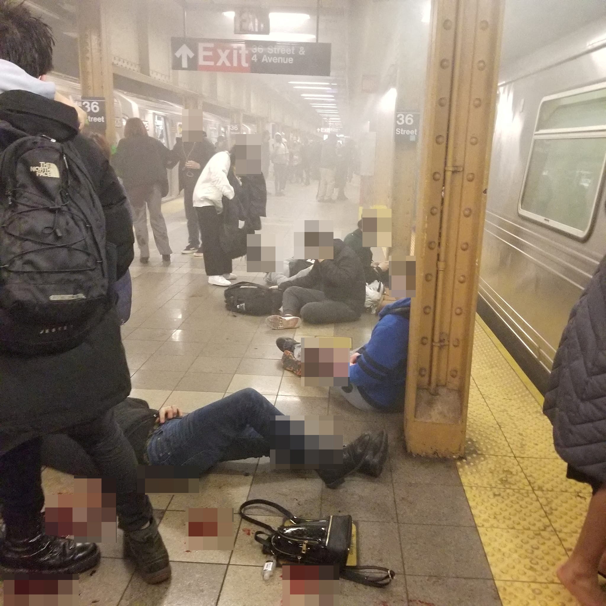 Victims lie on the subway platform after an attack at Brooklyn’s 36th Street station on 12 April