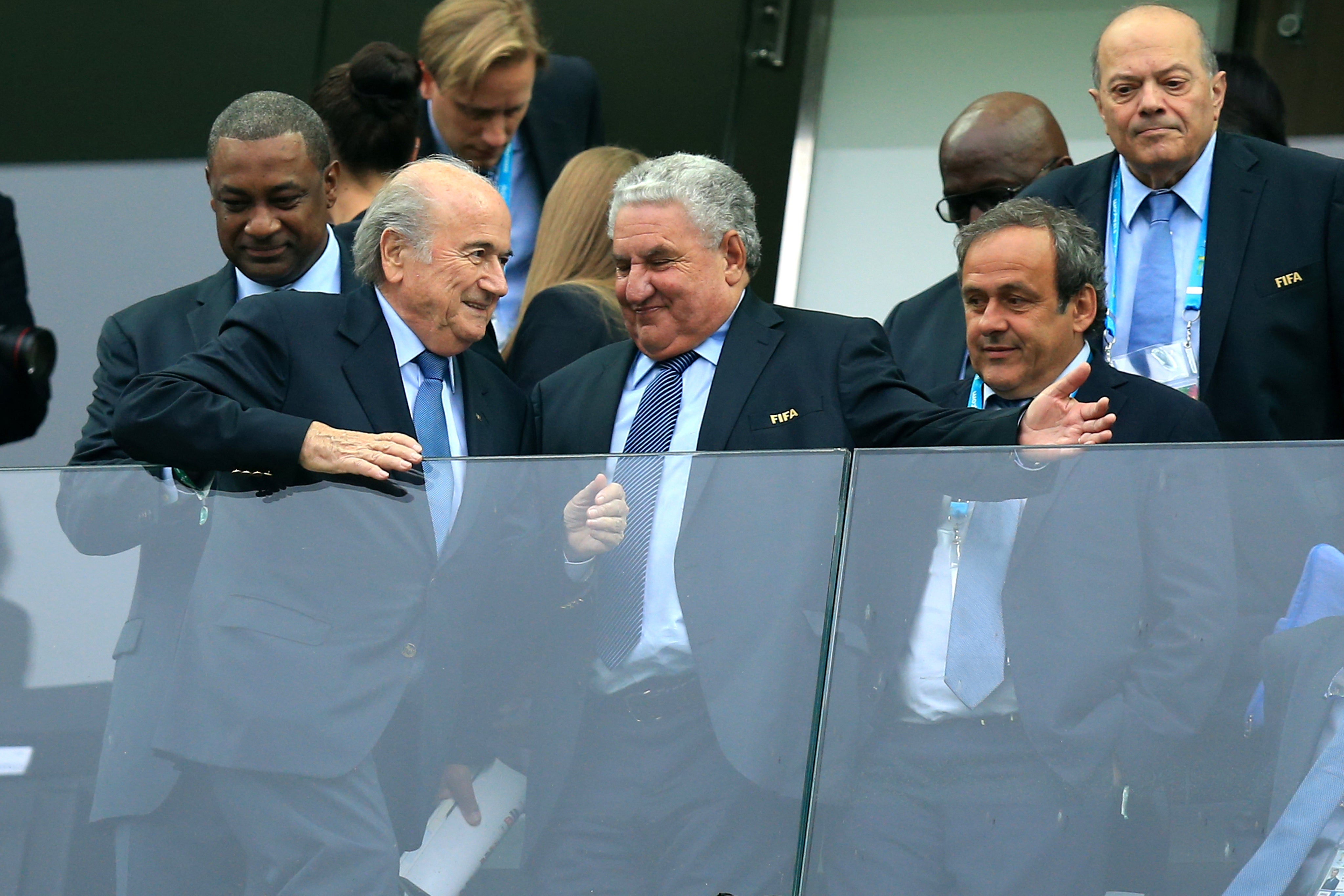 Sepp Blatter, front left, and Michel Platini, front row right, face trial in Switzerland in June (Mike Egerton/PA)