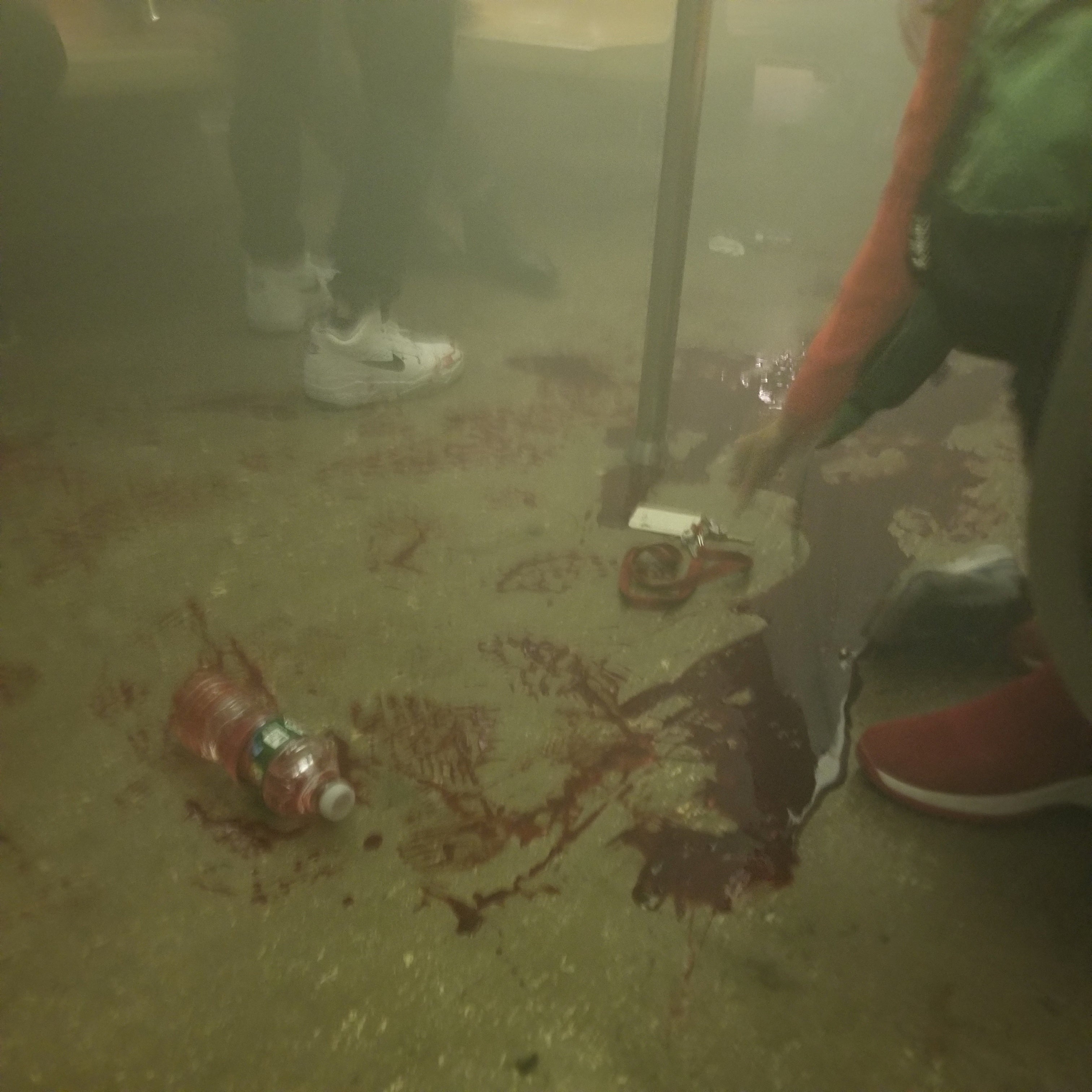 Blood is seen at the 36th Street subway station after a shooting, in New York City