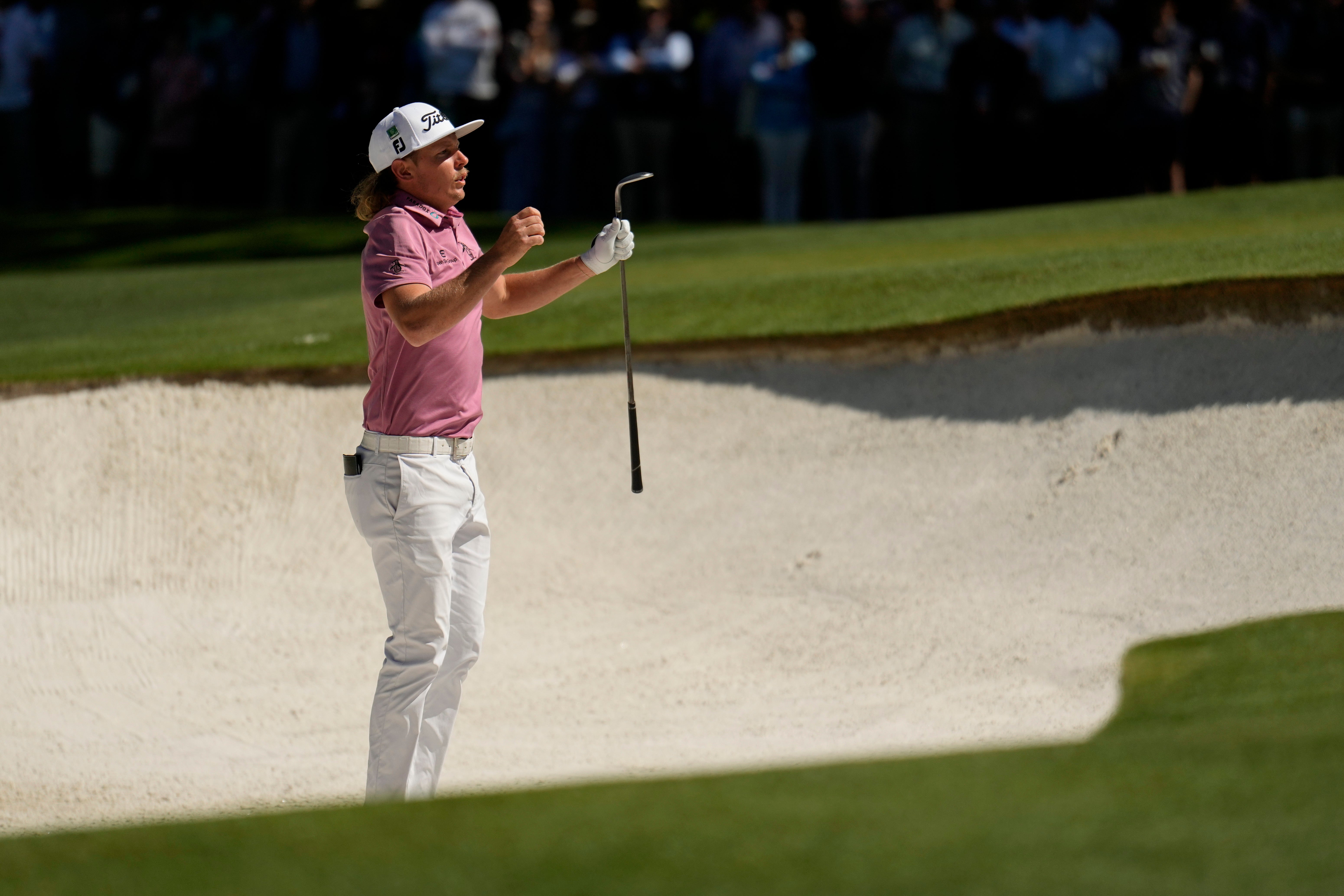 Cameron Smith jumps up to see the pin from a bunker on the fourth hole during the final round of the Masters (Matt Slocum/AP)