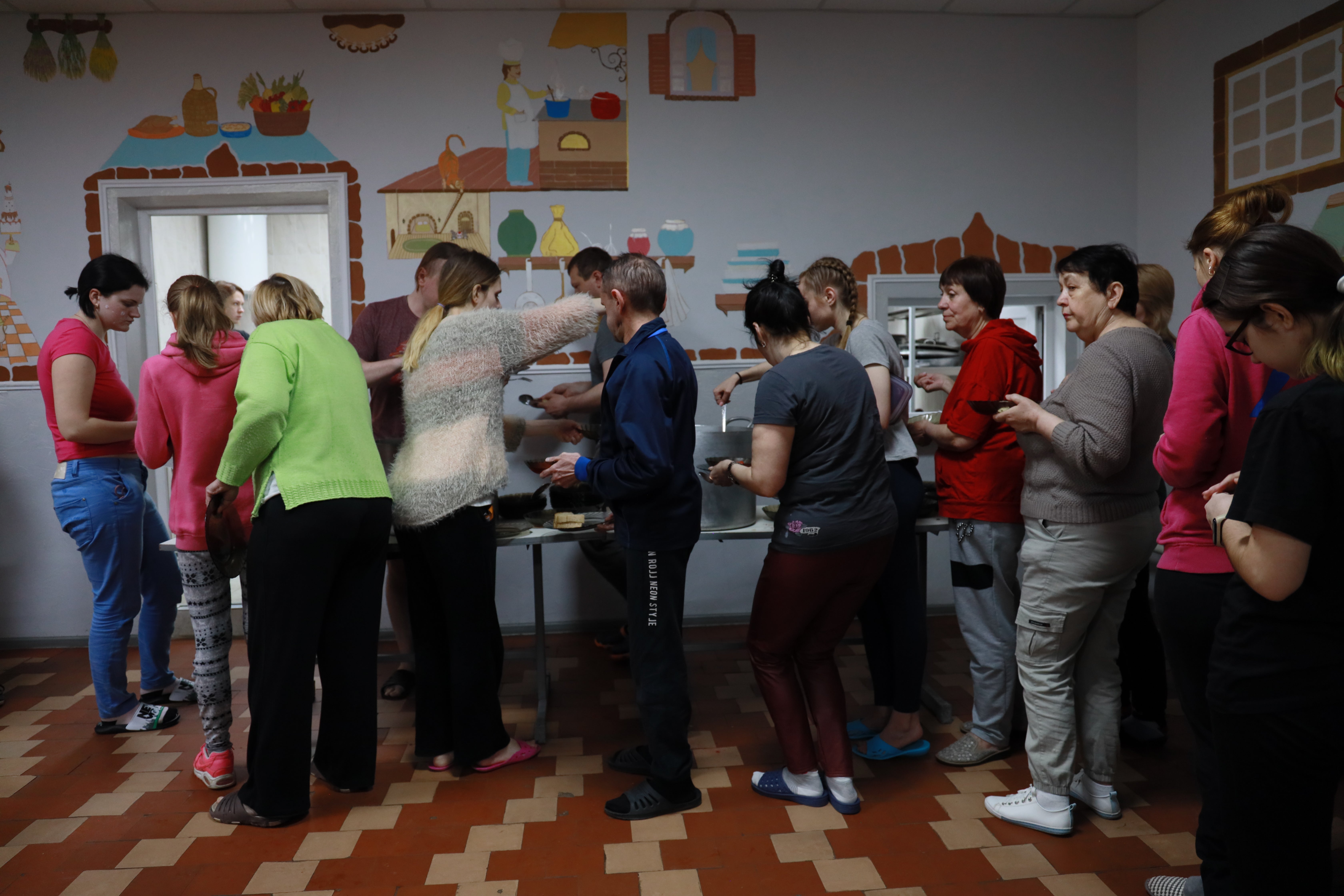 People wait for food in one of the centres in Chernivtsi