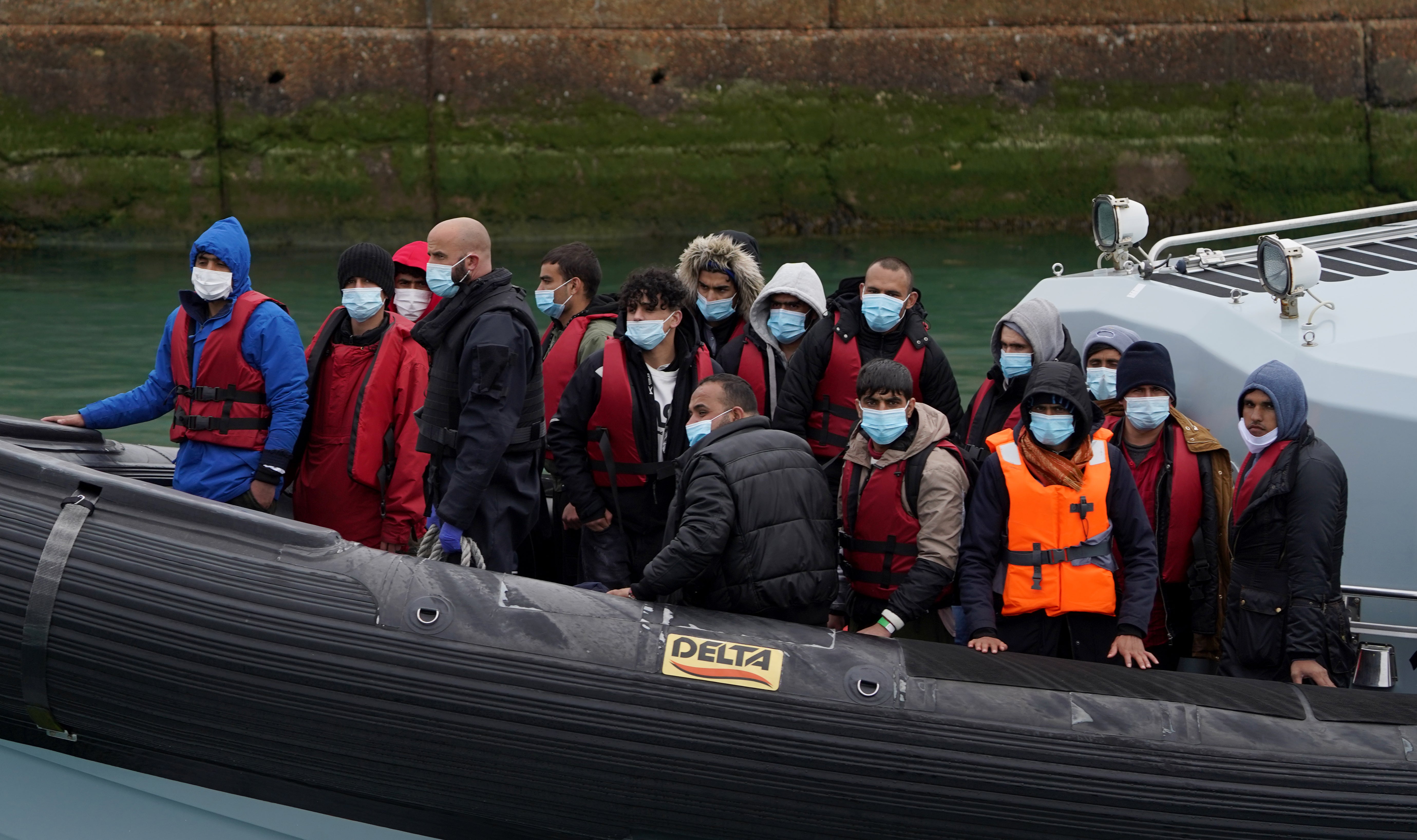 A group of people thought to be migrants are brought in to Dover, Kent, onboard a Border Force vessel following a small boat incident in the Channel. Picture date: Wednesday April 13, 2022. (Gareth Fuller/PA)