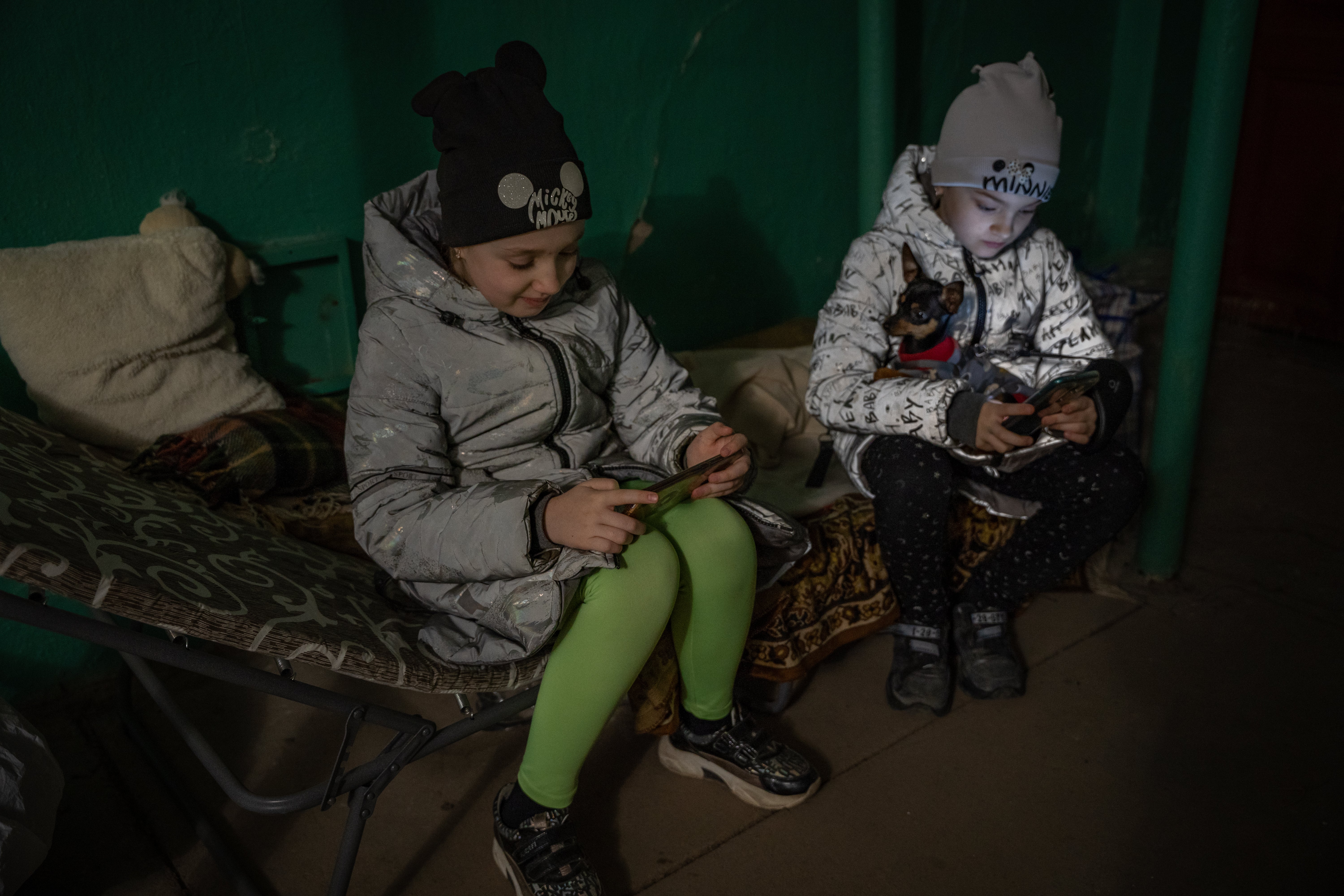 Children take shelter in a basement turned makeshift bomb shelter in Mykolaiv