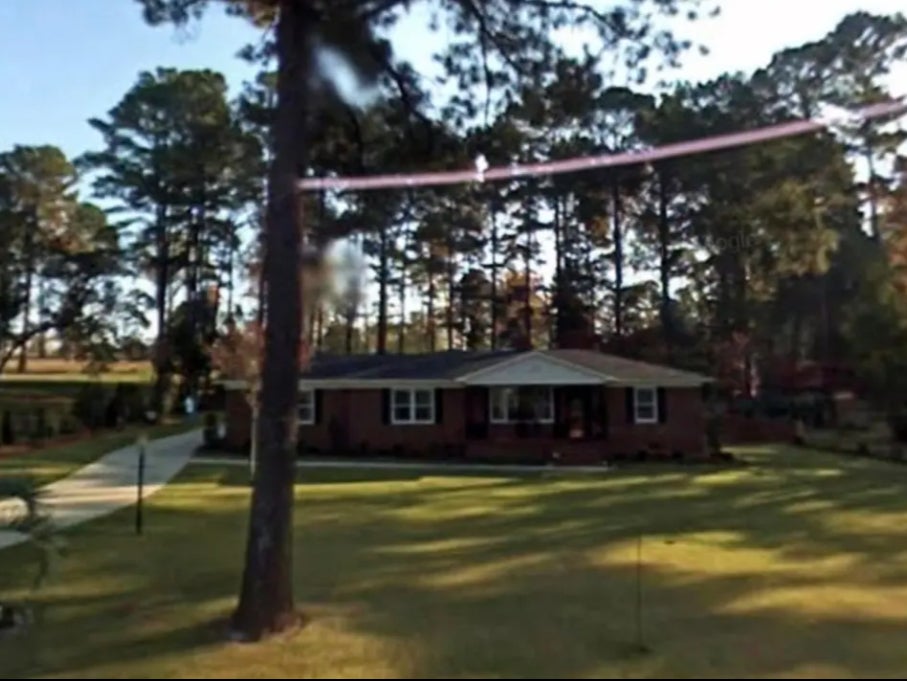 The Thacker home just outside of Augusta National Golf Club in Georgia. The home was built by Herman and Elizabeth Thacker in 1959, and the couple refused to sell it to Augusta for years. Ms Thacker remains in the house to this day.