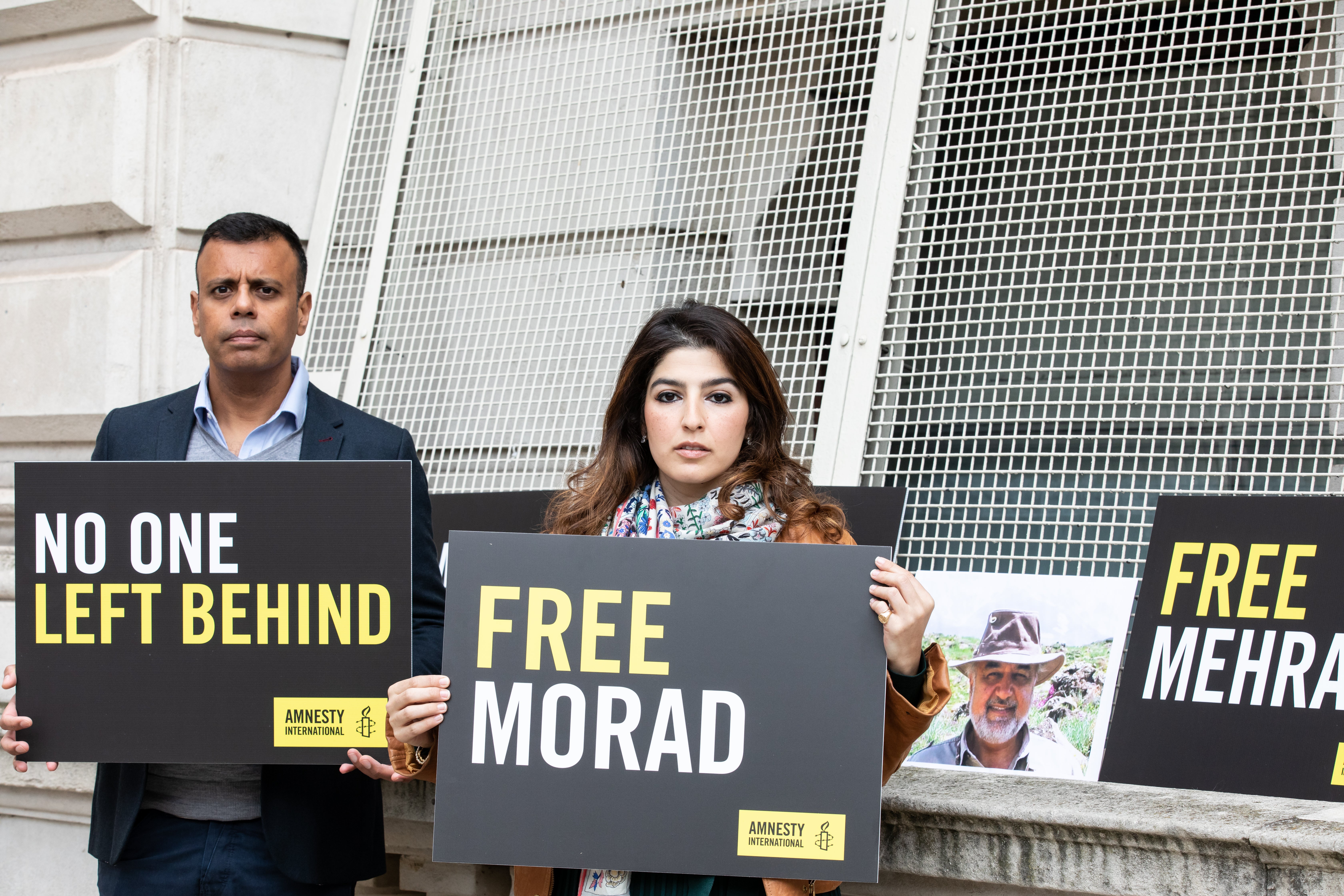 Roxanne Tahbaz and Sacha Deshmukh protest outside the Foreign Office, as Amnesty International launched new ‘No One Left Behind’ campaign