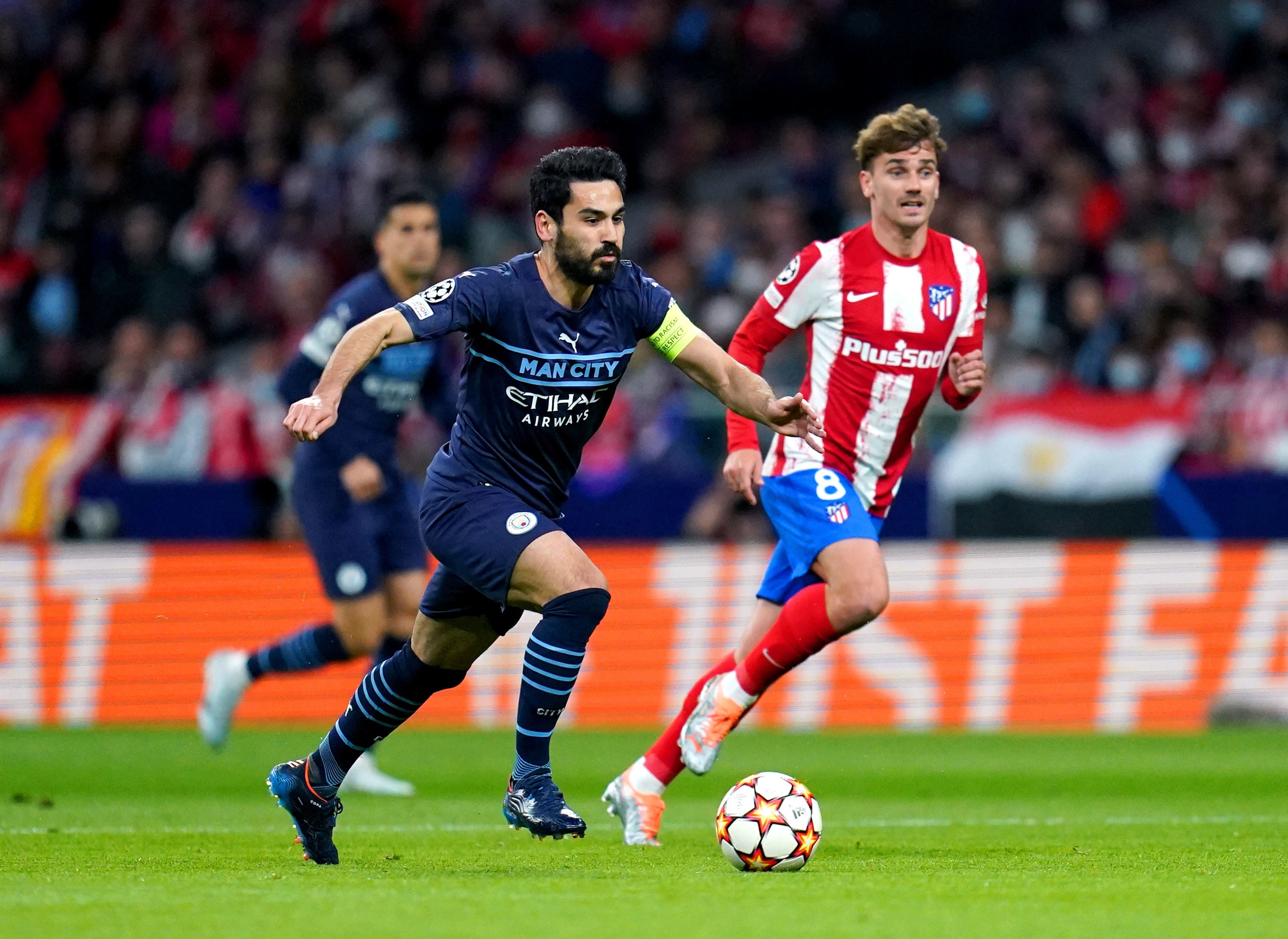 Ilkay Gundogan and Atletico Madrid’s Antoine Griezmann