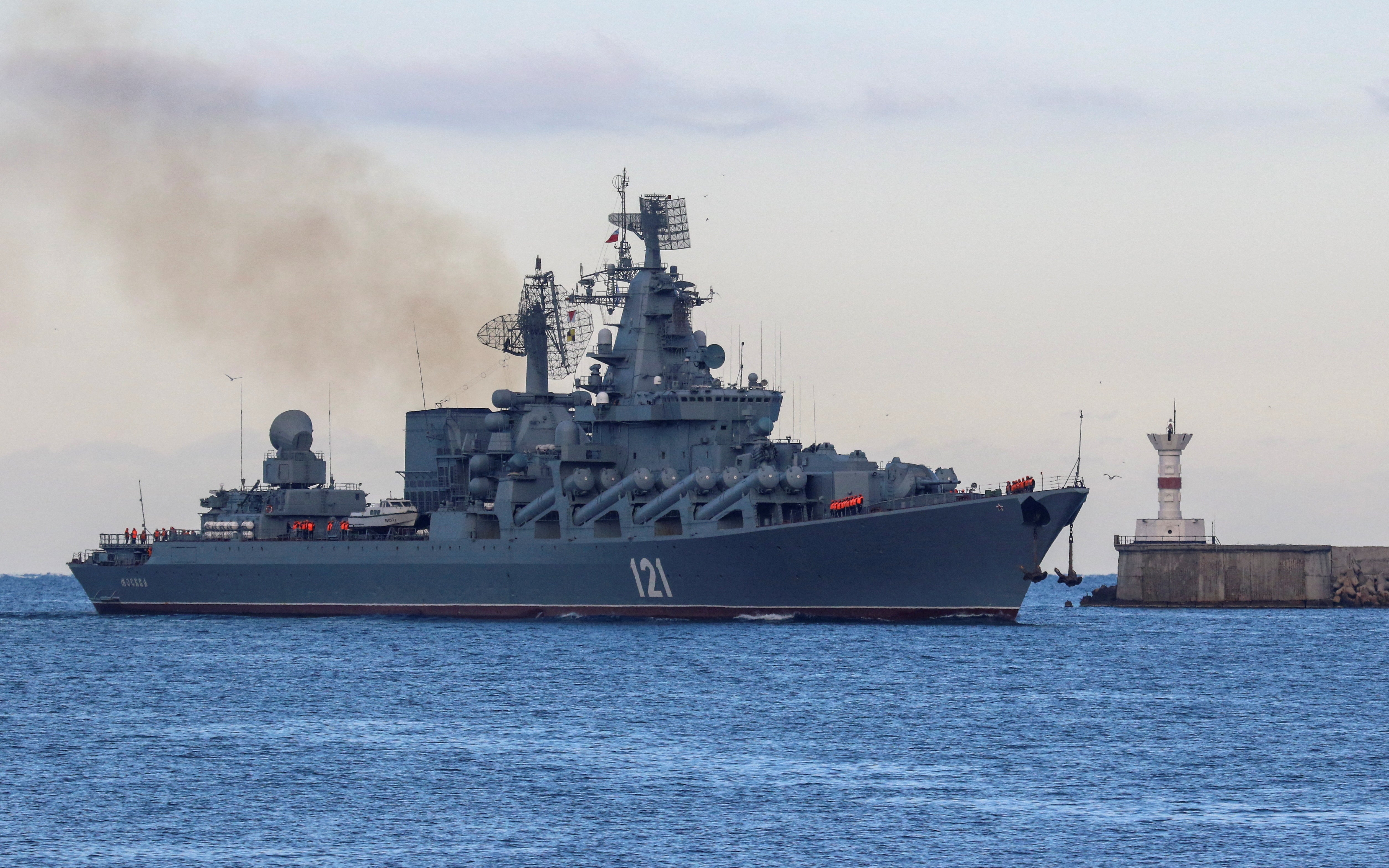 The Russian Navy's guided missile cruiser Moskva sails back into a harbour after tracking Nato warships in the Black Sea, in the port of Sevastopol, Crimea on 16 November 2021