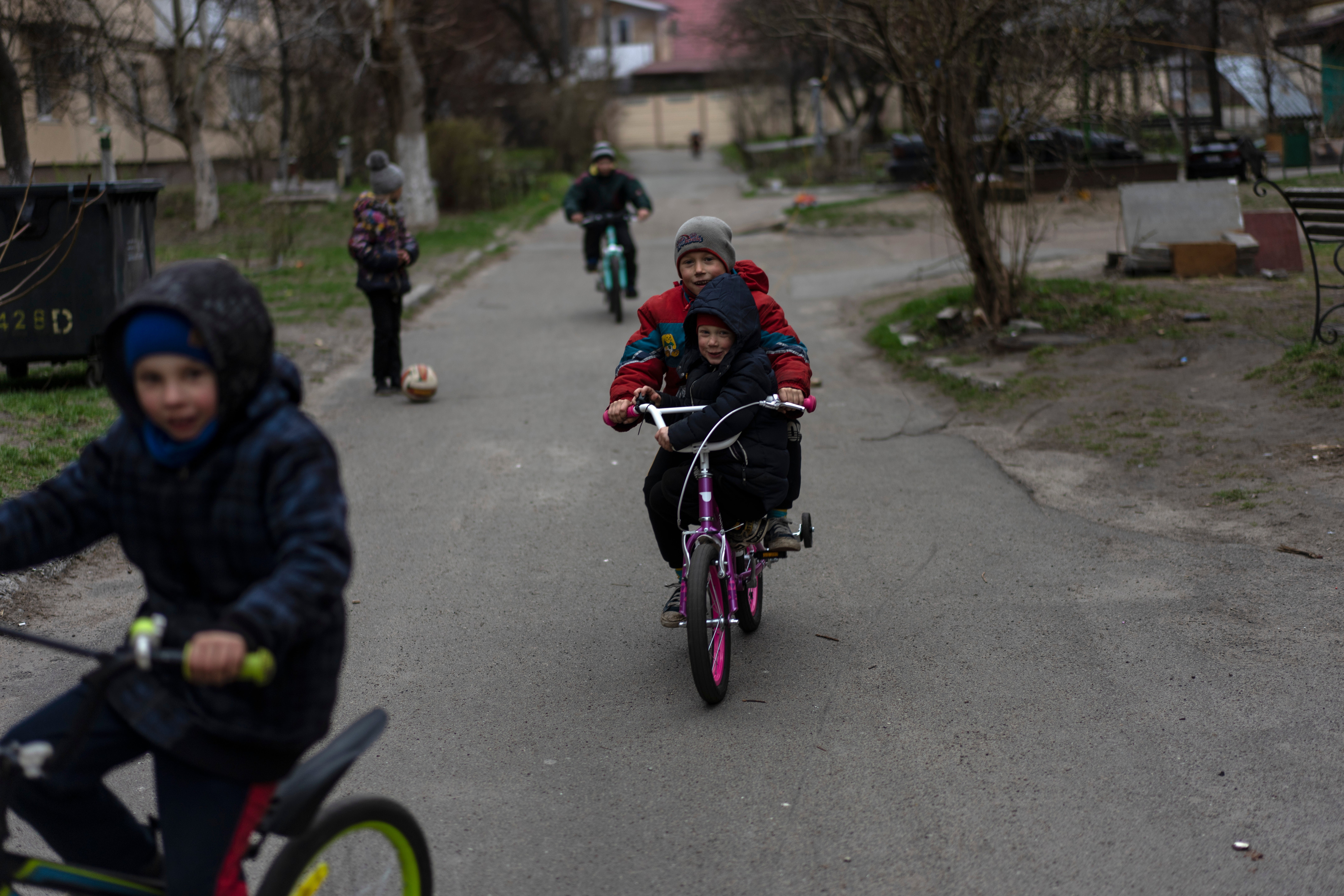 Children playing in Bucha on the outskirts of Kyiv, one of many sites of suspected war crimes by the Russian army