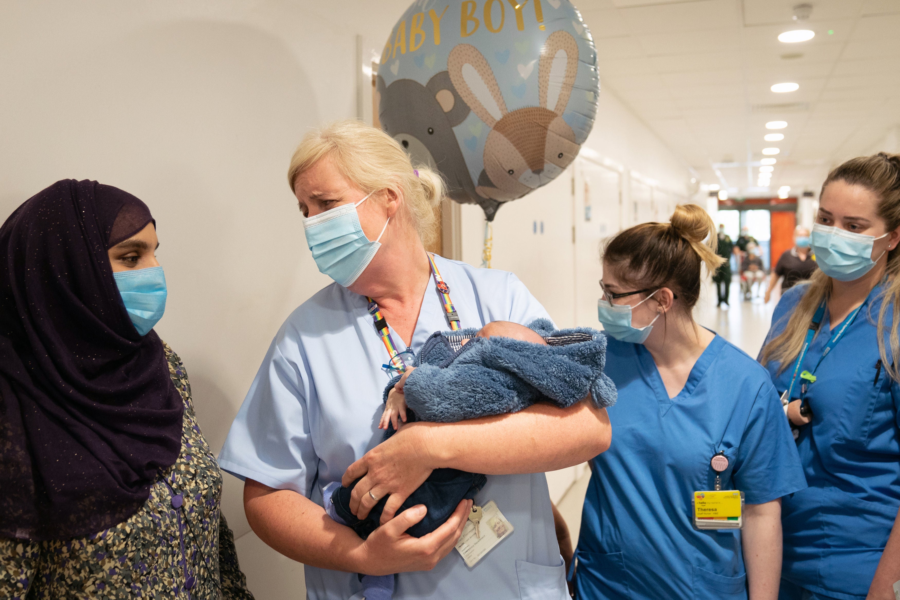 A&E nurse Helen Flanagan holds two-week-old baby Mohammed Ibrahim at Northwick Park Hospital in Harrow