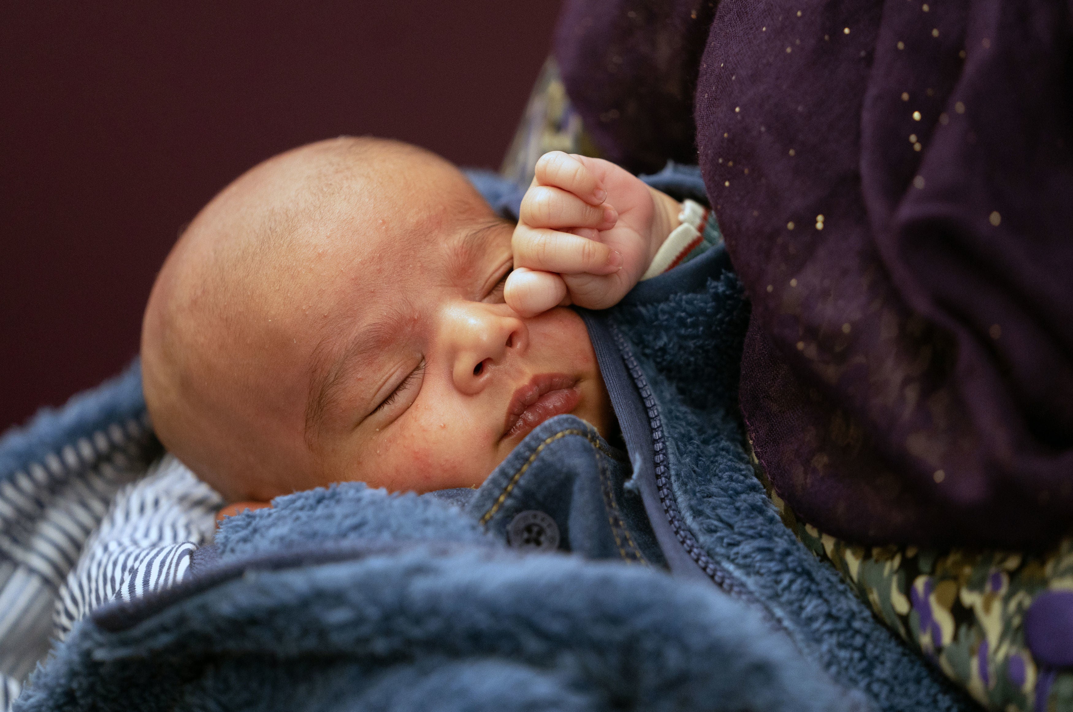 Two-week-old baby Mohammed Ibrahim sleeps in his mothers arms at Northwick Park Hospital in Harrow.