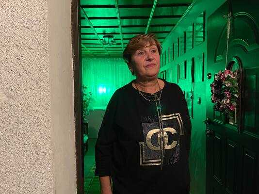 Maria Ancipiuk, 65, a town councilor in Michalowo, Poland, keeps a green light on in her home, a signal of a safe place for immigrants