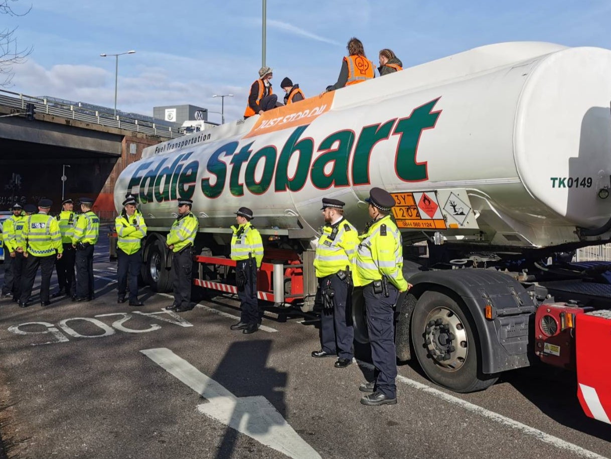 Thirty police surrounded the tanker as angry members of the public hurled abuse at the protesters